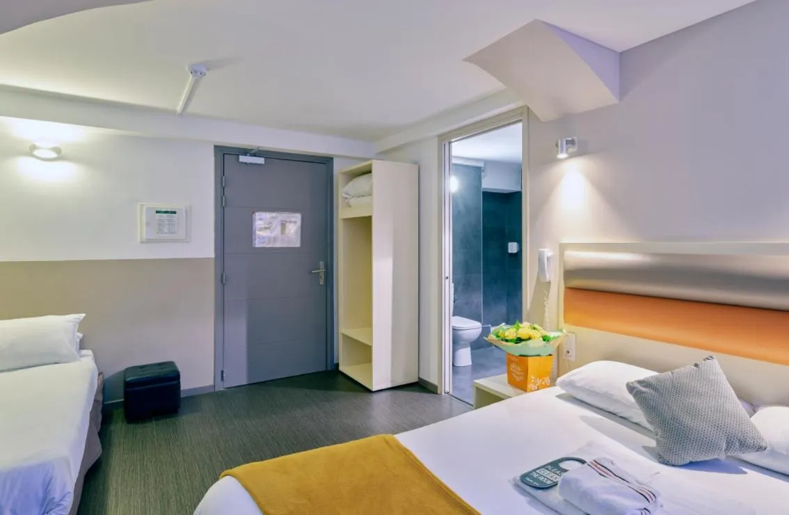 Bed in Adonis Hotel Strasbourg