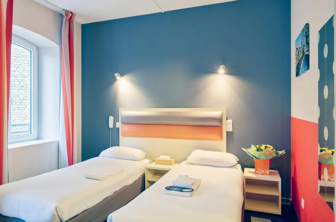 Bed in Adonis Hotel Strasbourg