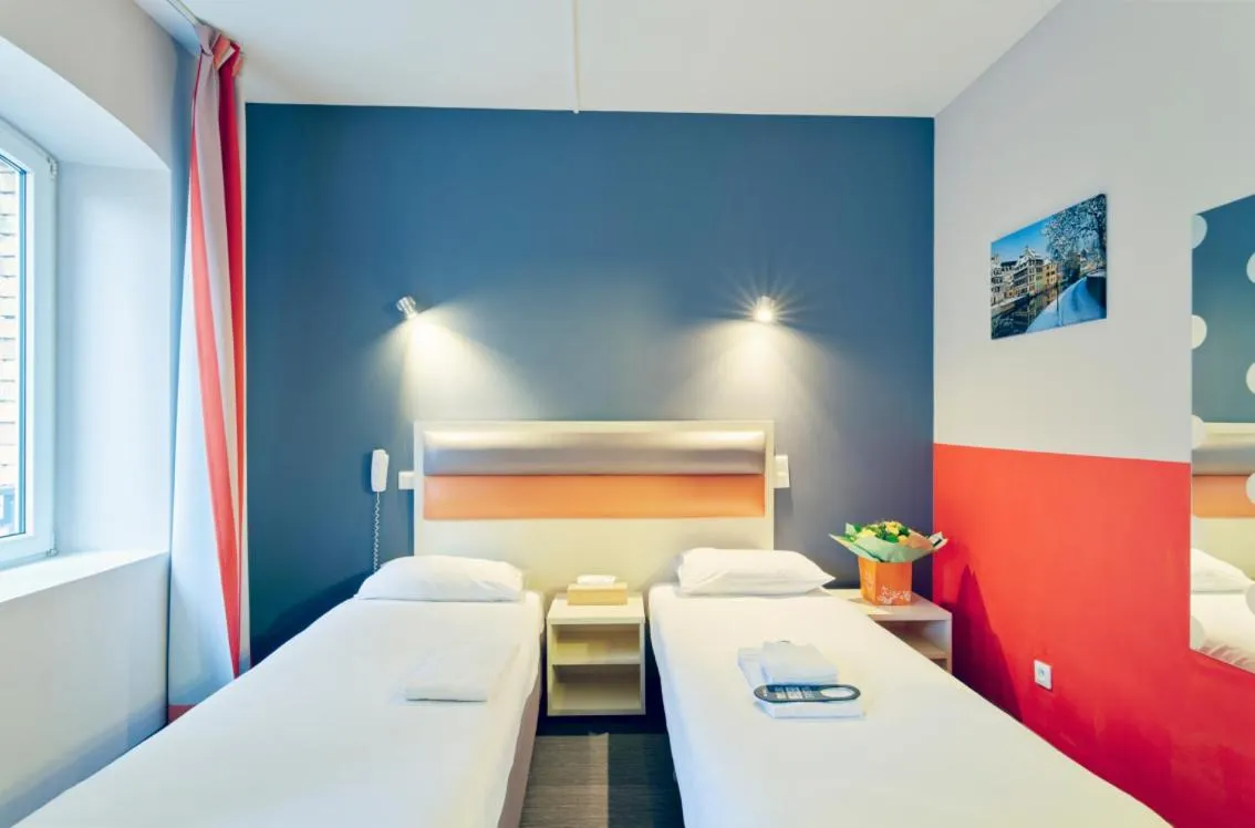 Bed in Adonis Hotel Strasbourg