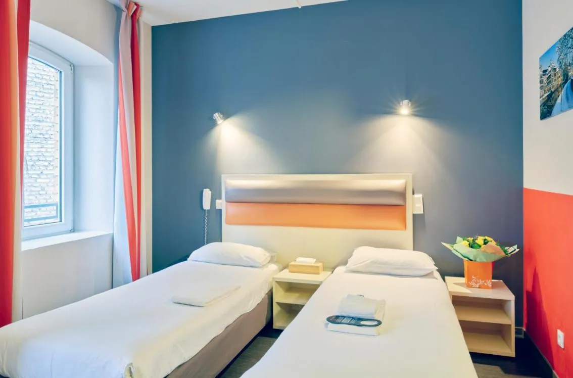 Bed in Adonis Hotel Strasbourg