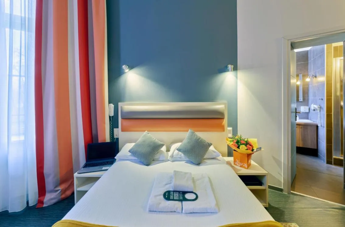 Bed in Adonis Hotel Strasbourg