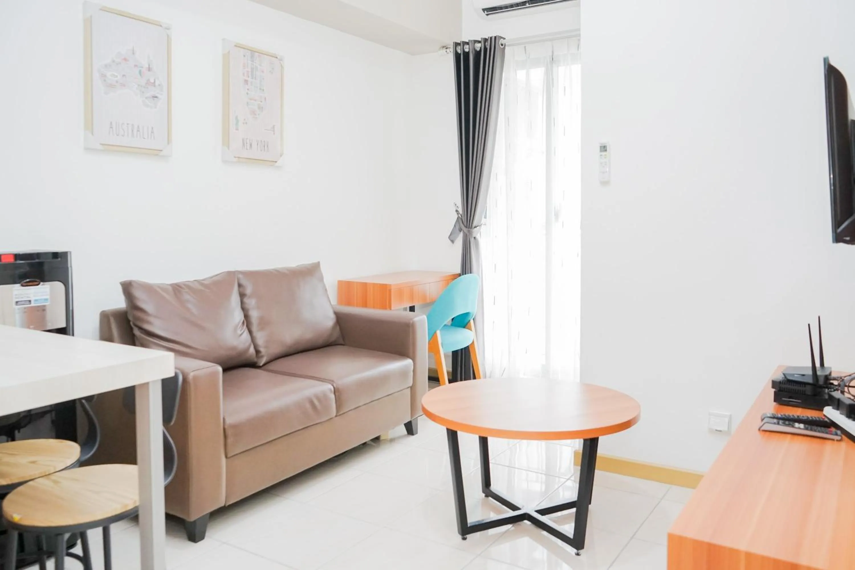 Living room in Great Choice 2BR Apartment at M-Town Residence By Travelio
