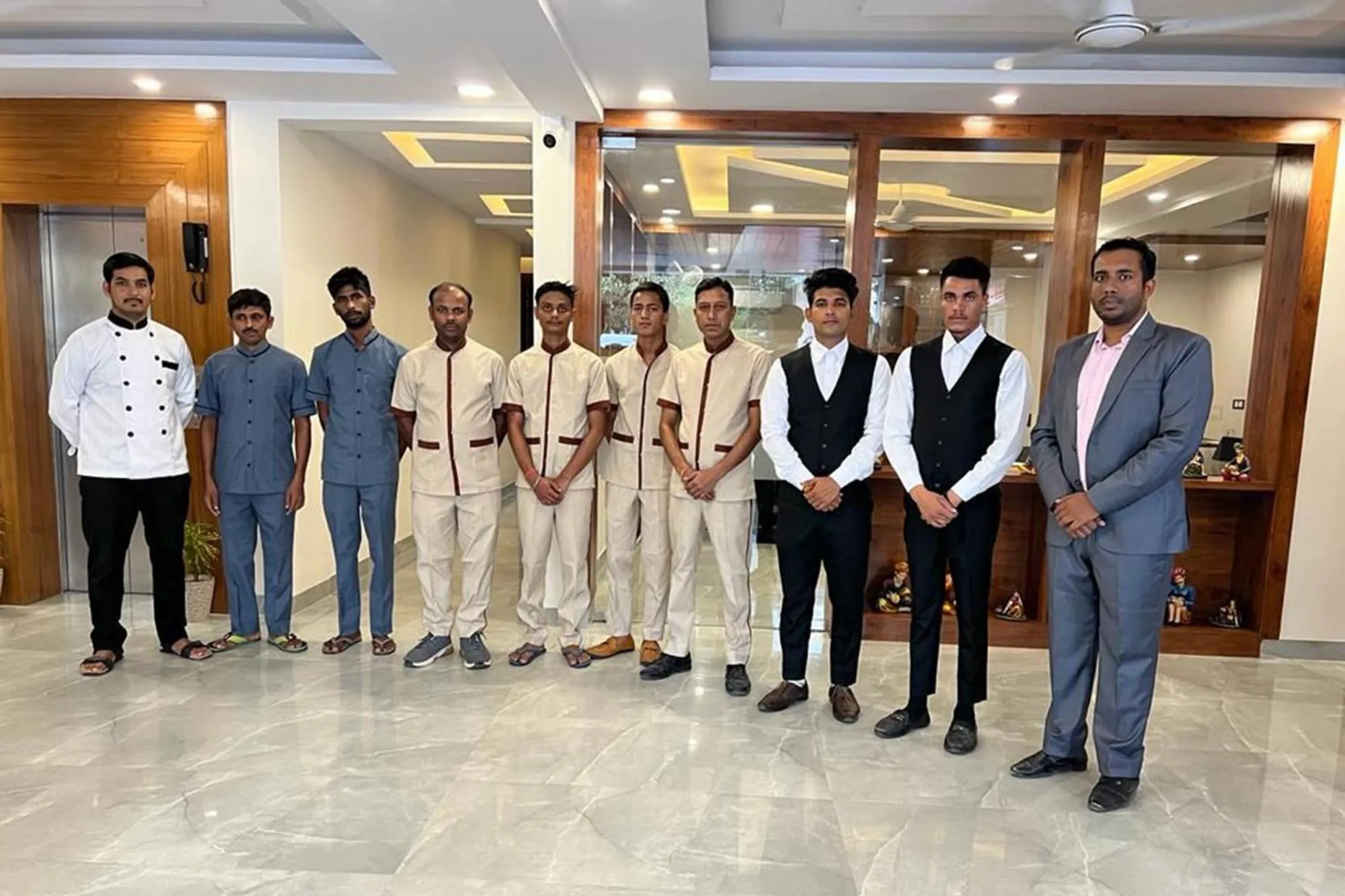 Staff in Hotel Golf Inn - Business-Friendly Stay near Golf Course Road, Cyberhub & Metro