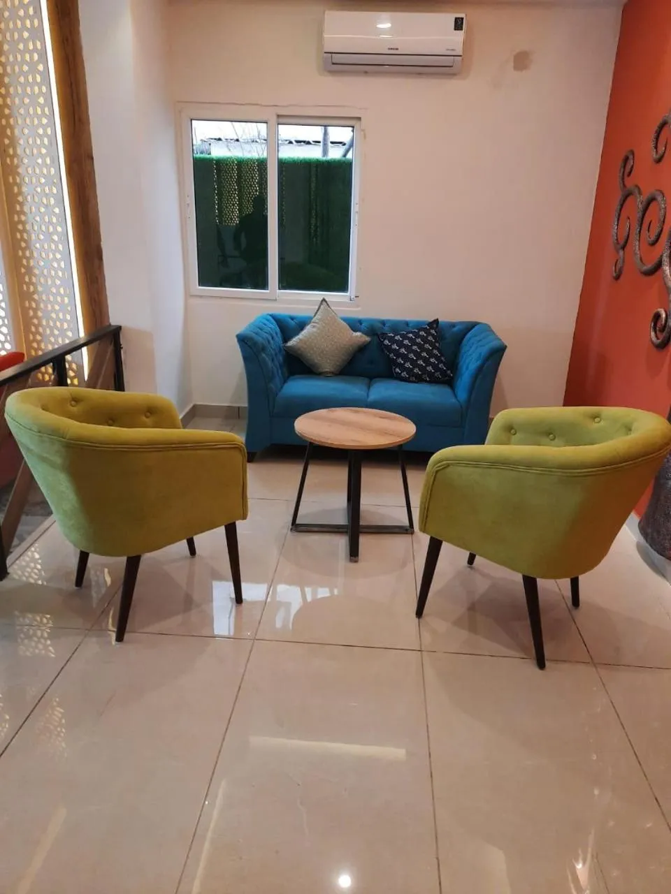 Seating area in Regenta INN Grand Koramangala by Royal Orchid Hotels