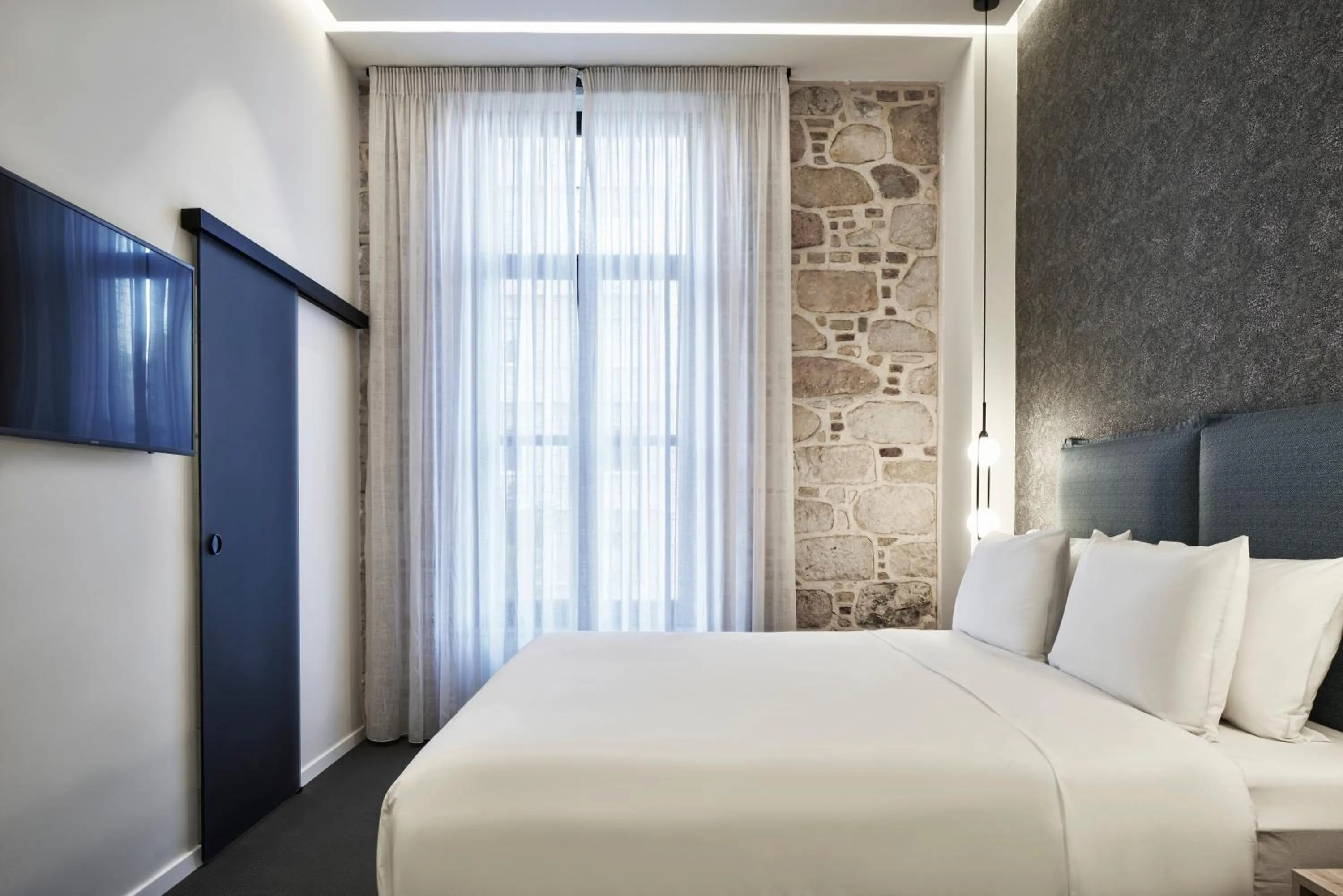 Bed in NLH MONASTIRAKI - Neighborhood Lifestyle Hotels