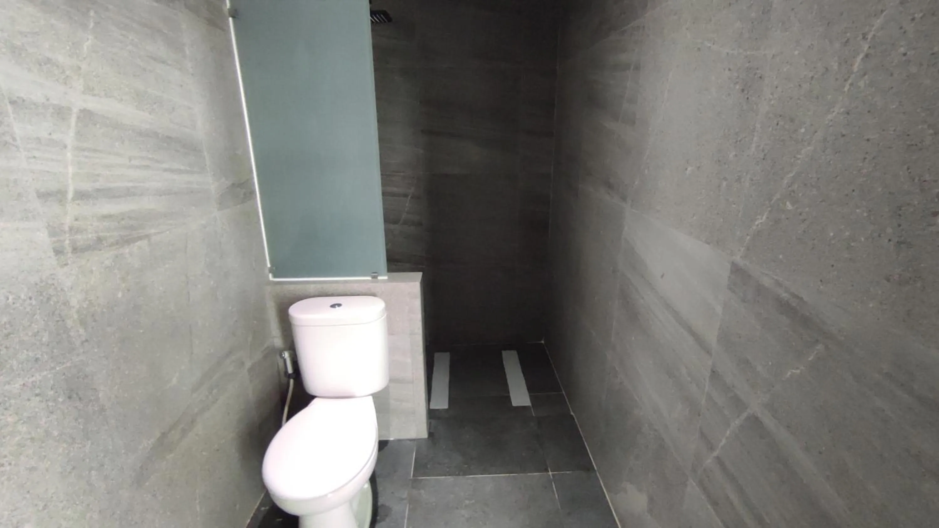 Bathroom in Americano Hotel Syariah Yogyakarta