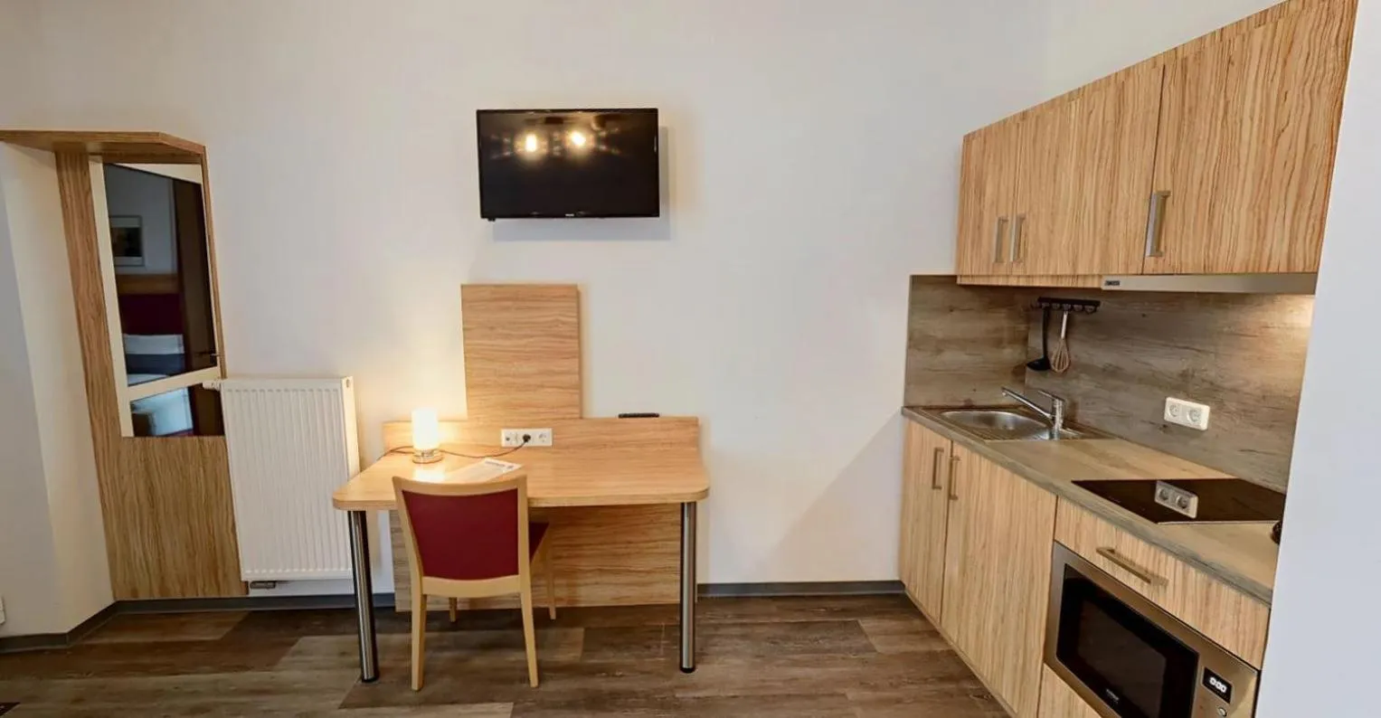 Kitchen or kitchenette in SmartMotel Emden - by Quartier96 GmbH