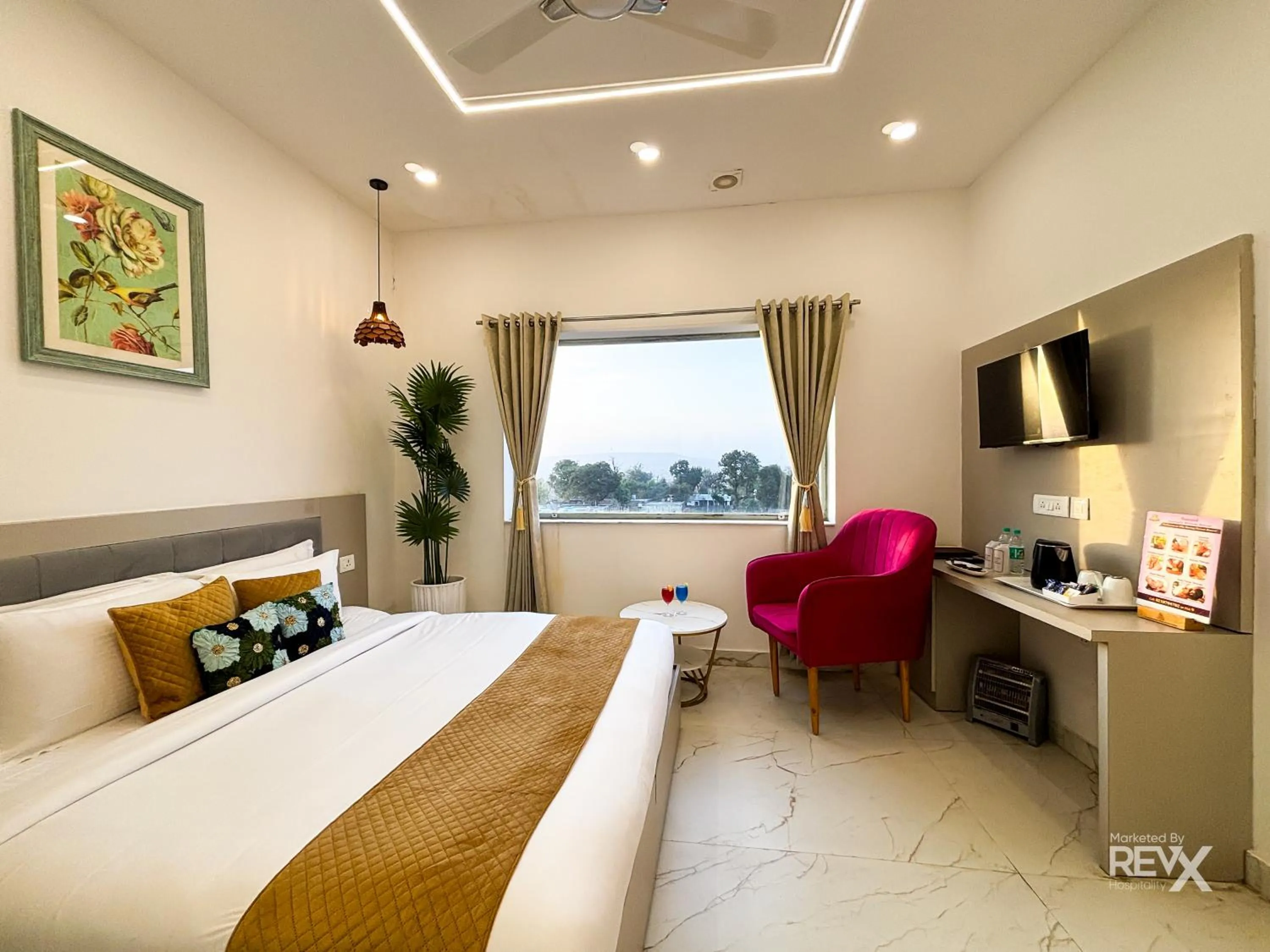 Bed in The Neeraj River Forest Resort Ayurvedic Wellness Center