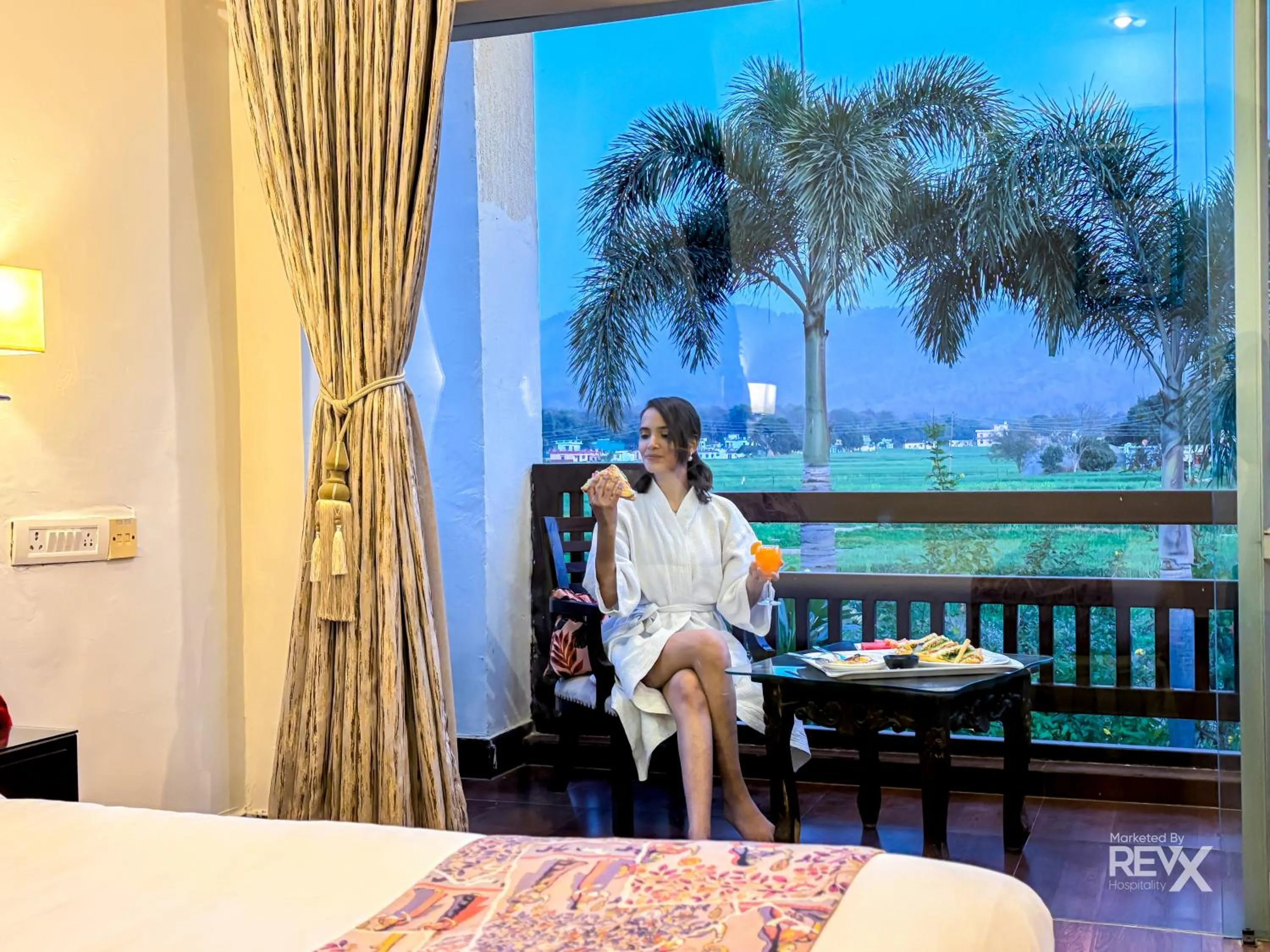 Bed in The Neeraj River Forest Resort Ayurvedic Wellness Center