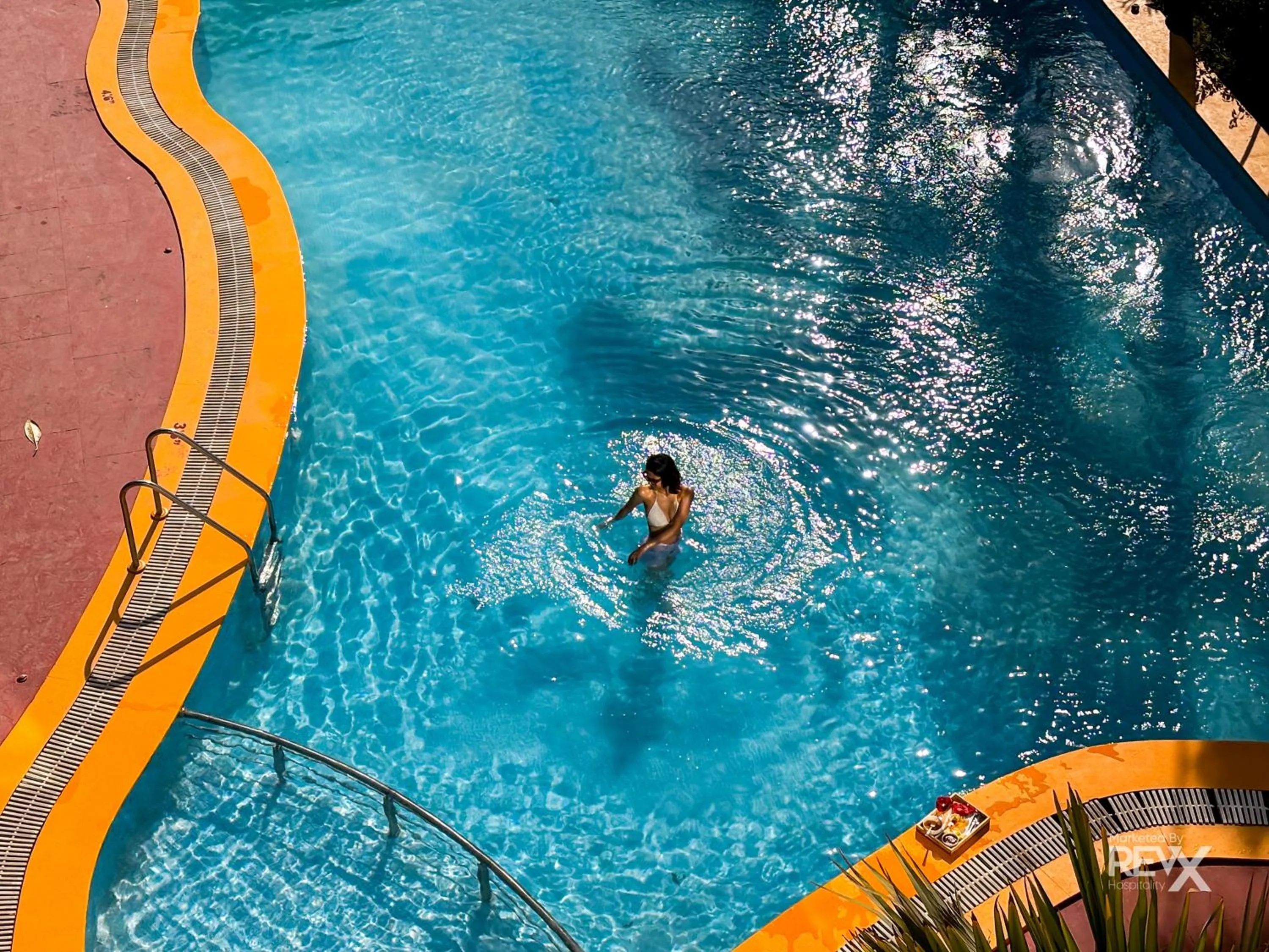 Swimming pool in The Neeraj River Forest Resort Ayurvedic Wellness Center