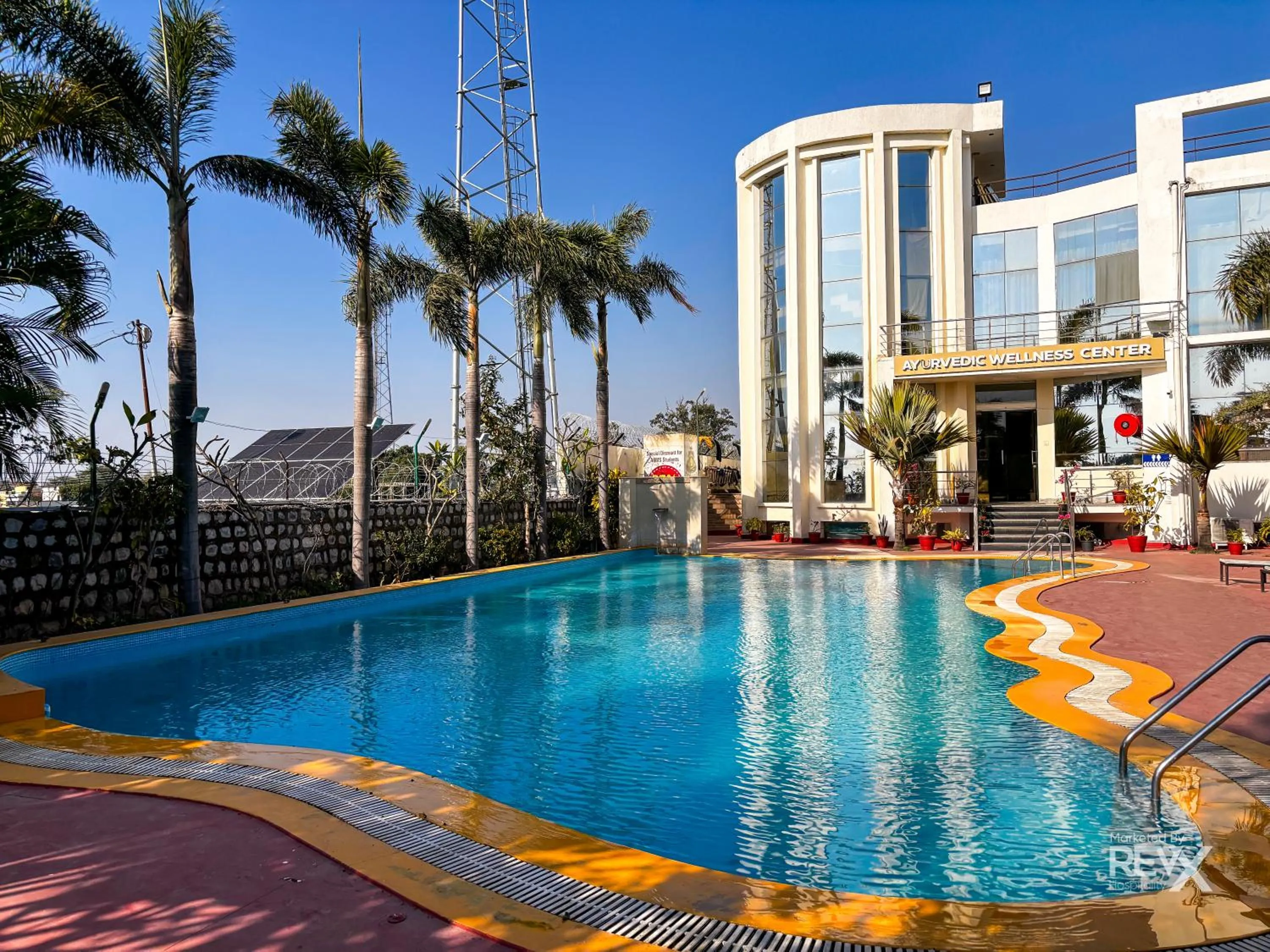 Swimming pool in The Neeraj River Forest Resort Ayurvedic Wellness Center