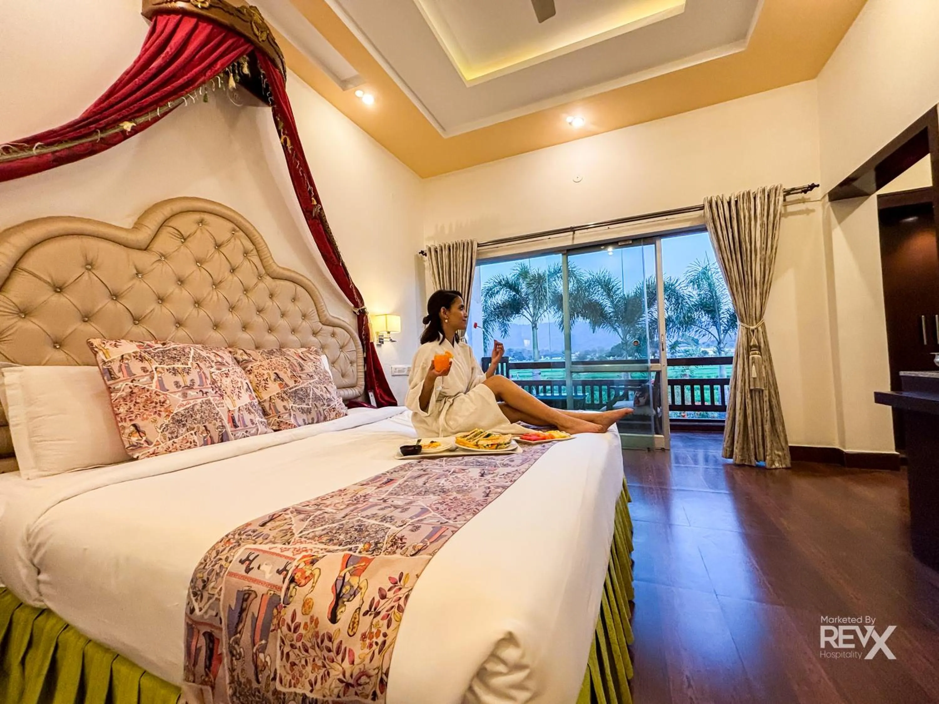 Bed in The Neeraj River Forest Resort Ayurvedic Wellness Center