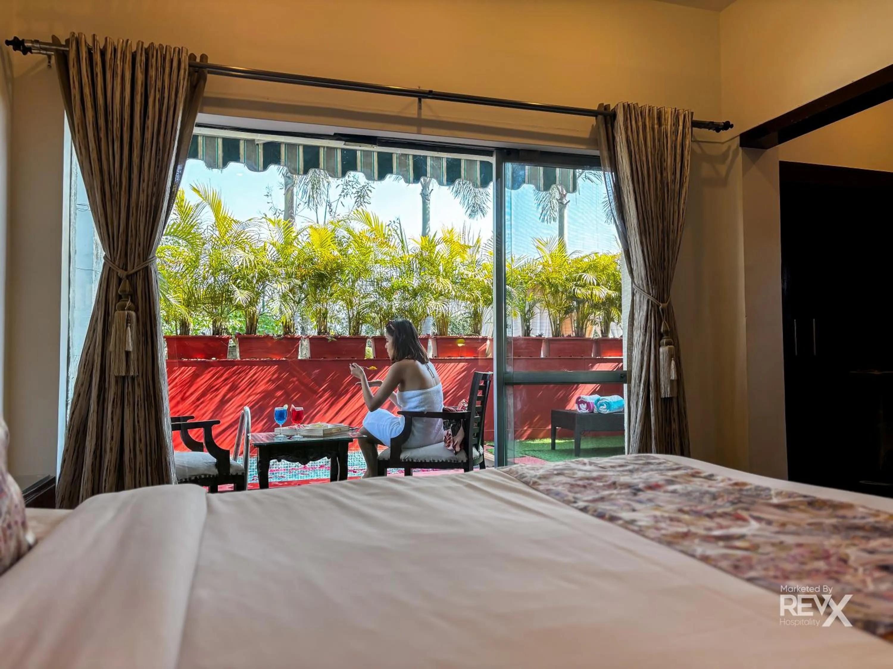 Bed in The Neeraj River Forest Resort Ayurvedic Wellness Center