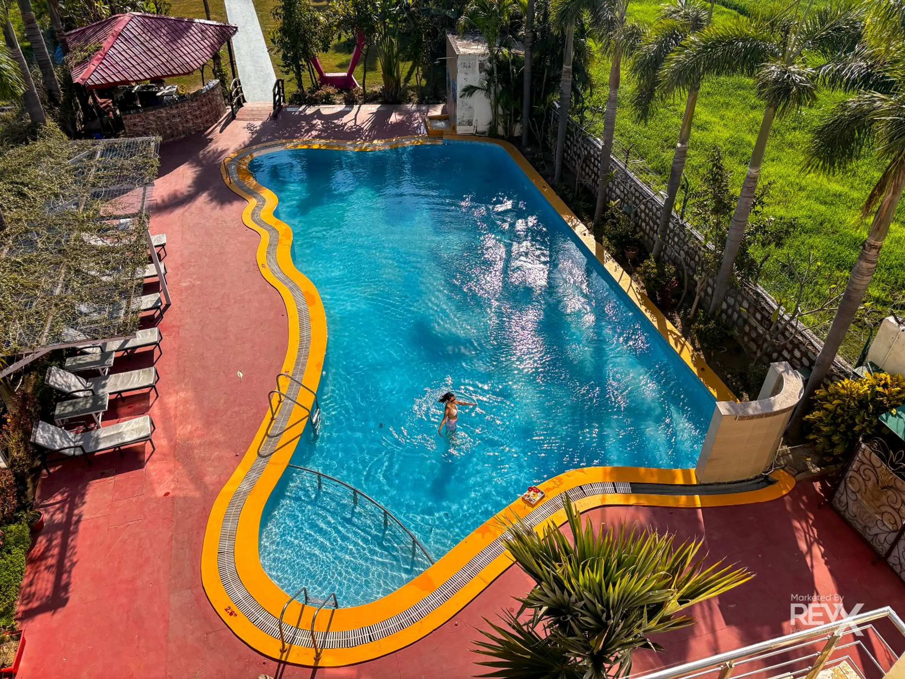 Swimming pool in The Neeraj River Forest Resort Ayurvedic Wellness Center