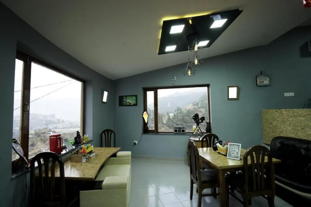 Dining area in Icebergs Mussoorie - A Boutique stay and 24 hrs roof top cafe