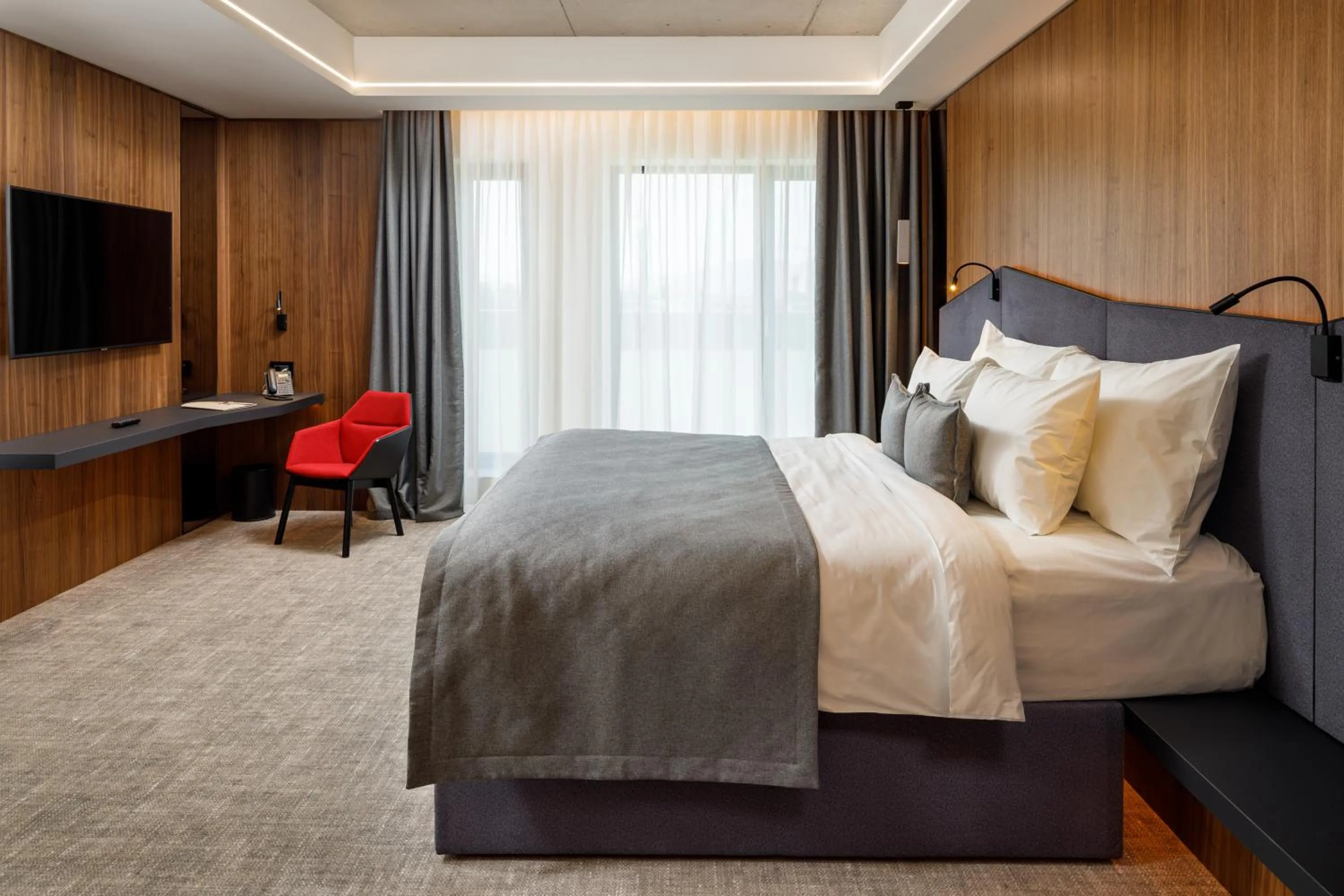 Bed in Qosmo Brasov Hotel