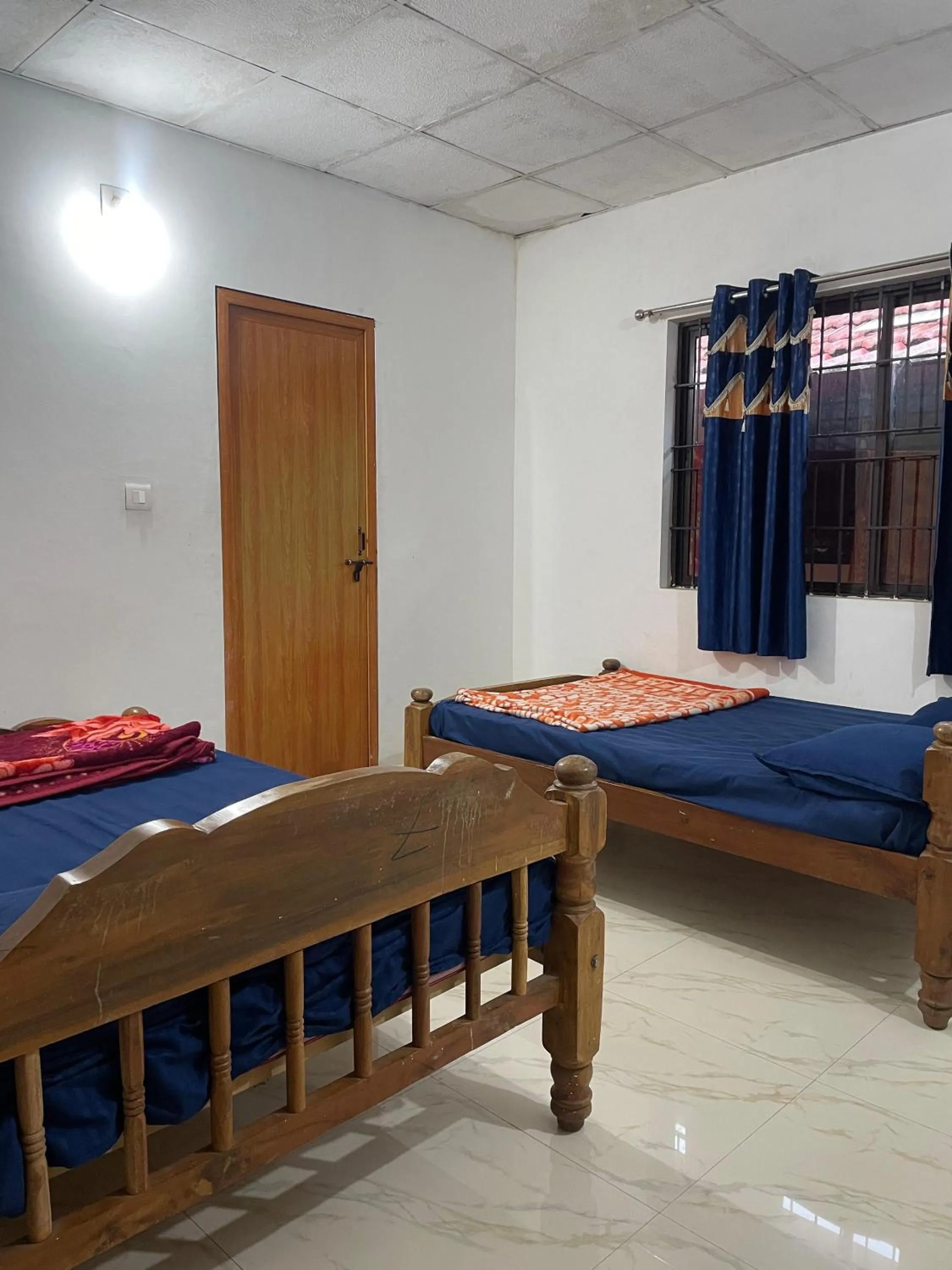 Bed in Nisarga Homestay
