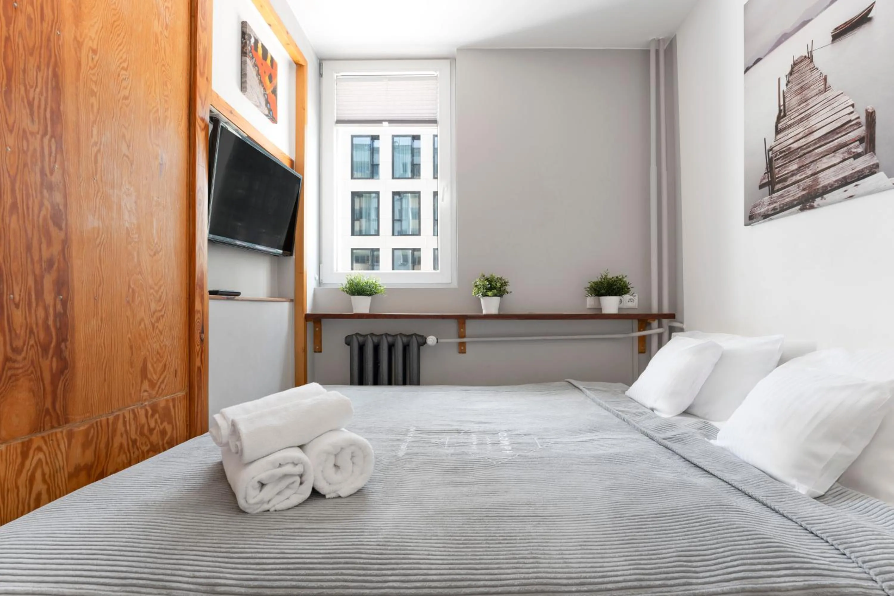 Bed in oompH Warsaw Central Apartment