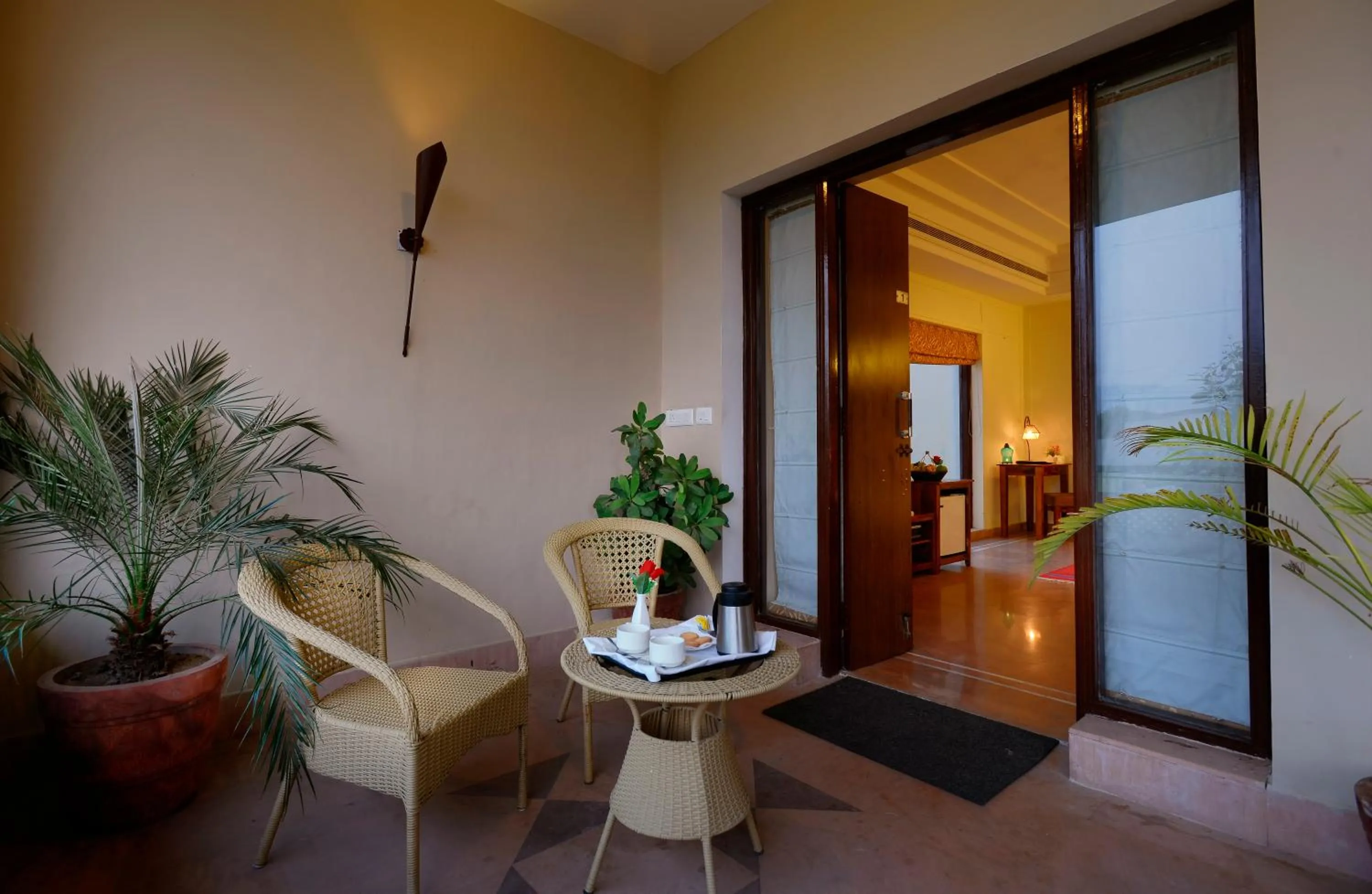 Seating area, Bed in Achrol Niwas A TreeHouse Hotel