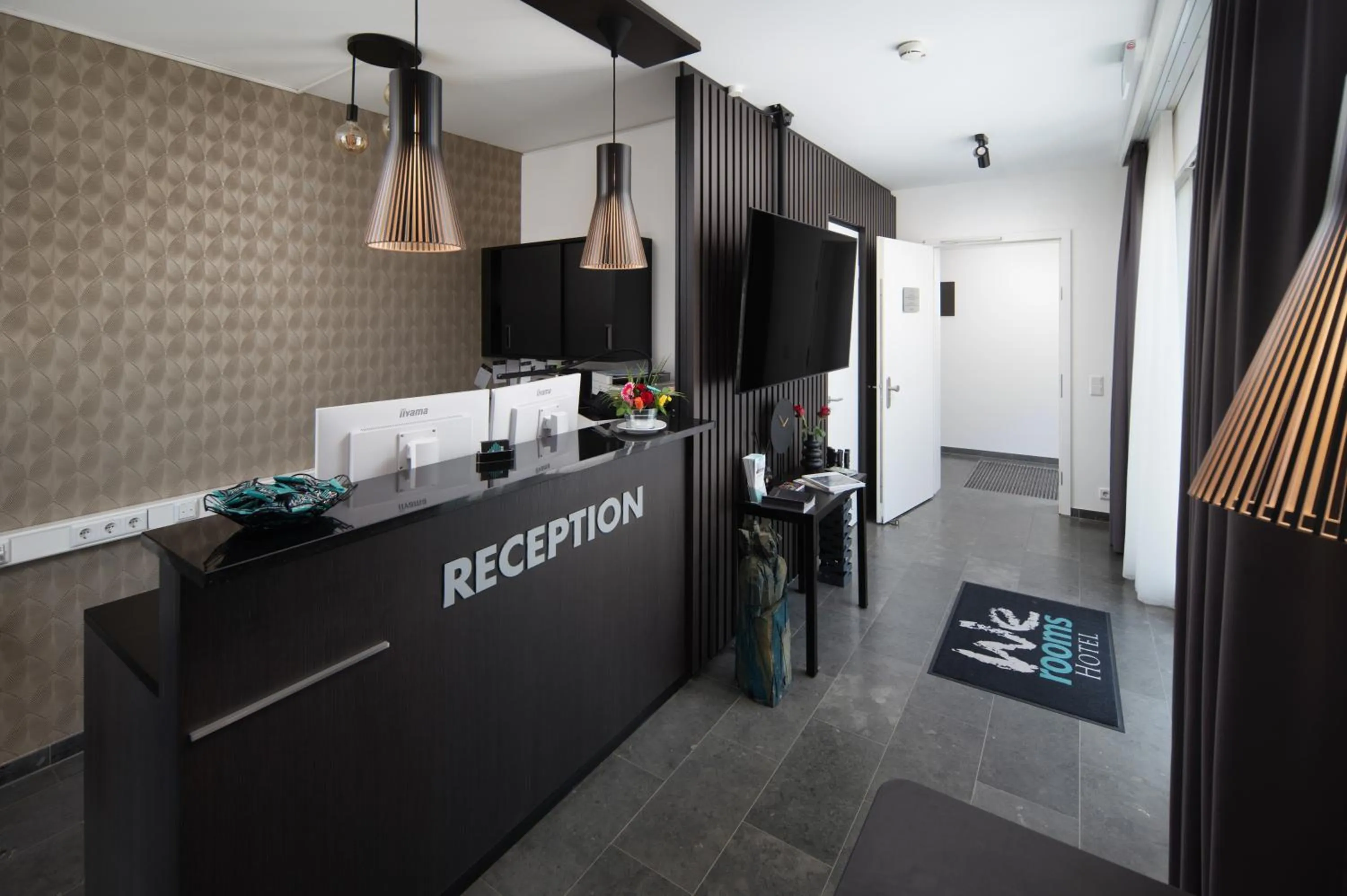 Lobby or reception in We rooms Hotel