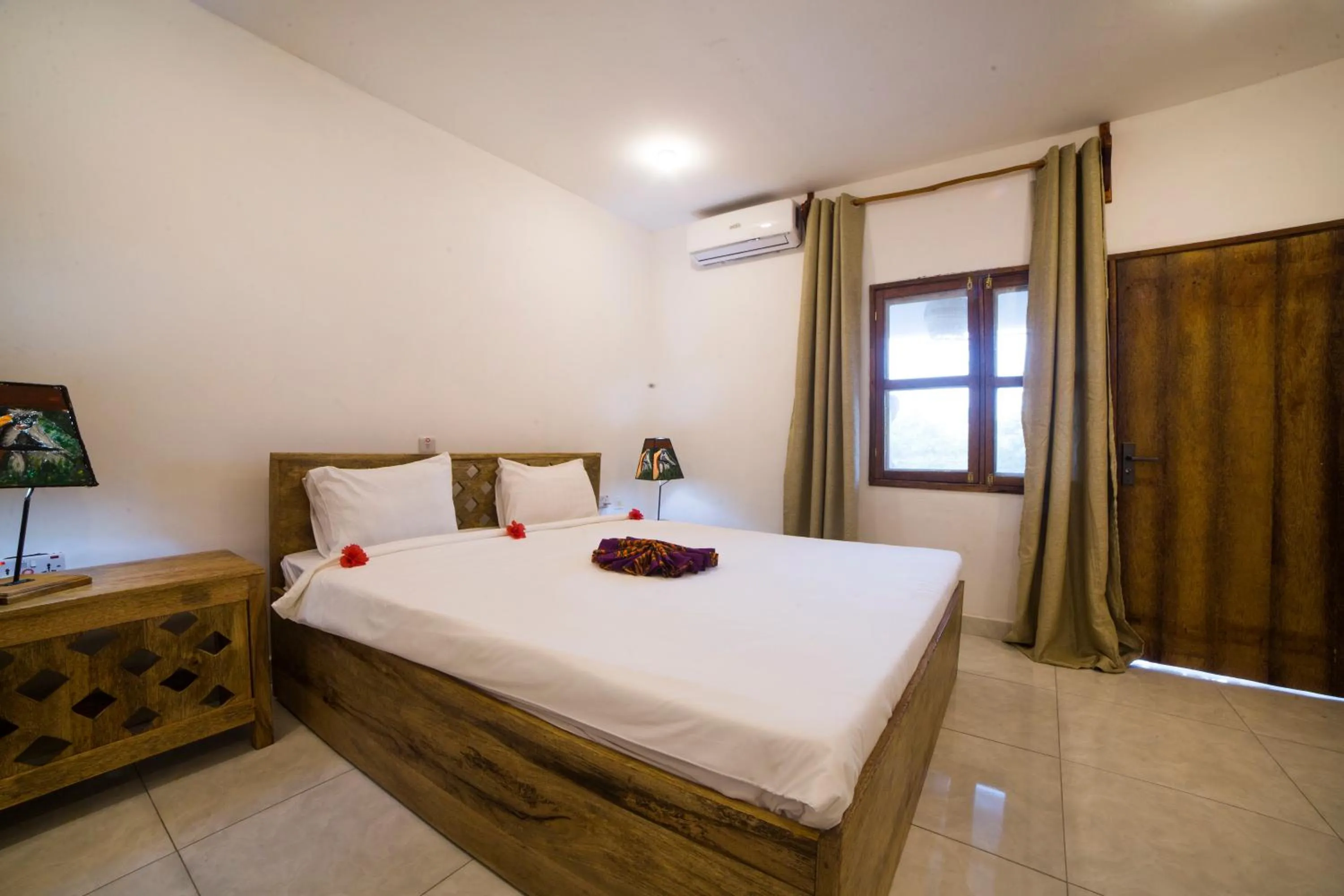 Bed in Antonio Beach Tree House Hotel & Spa