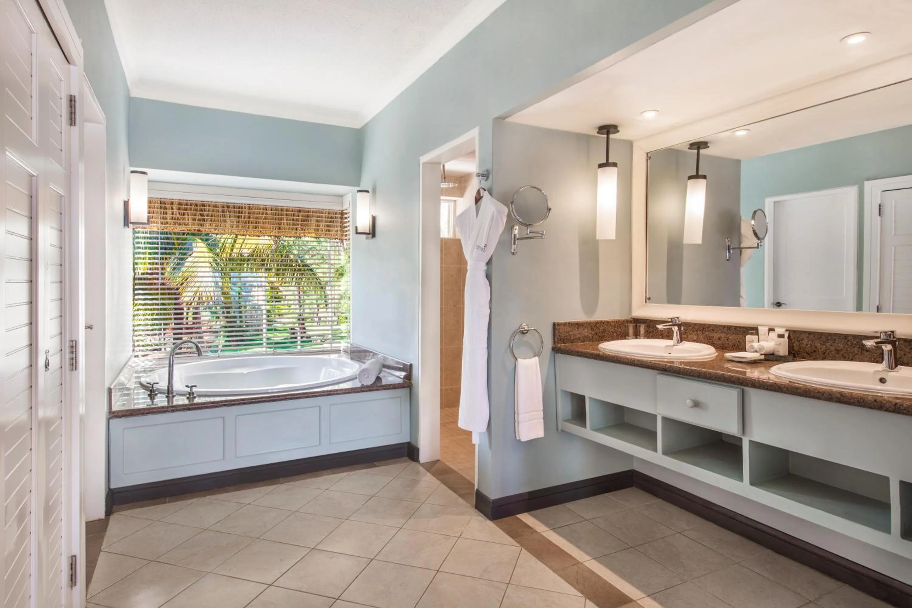 Bathroom, Bed in Outrigger Mauritius Beach Resort