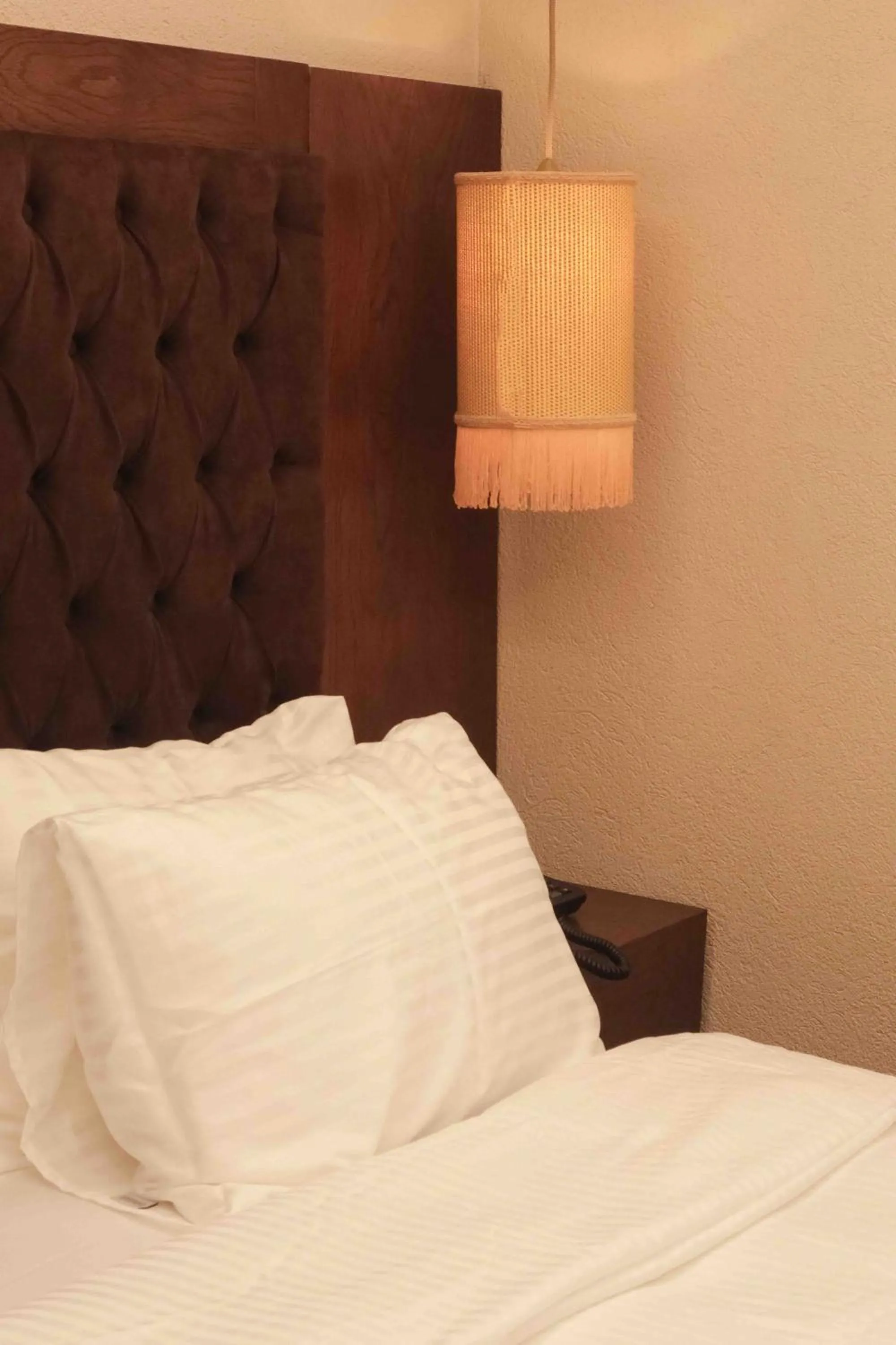 Bed in Phellos Suites Boutique Hotel