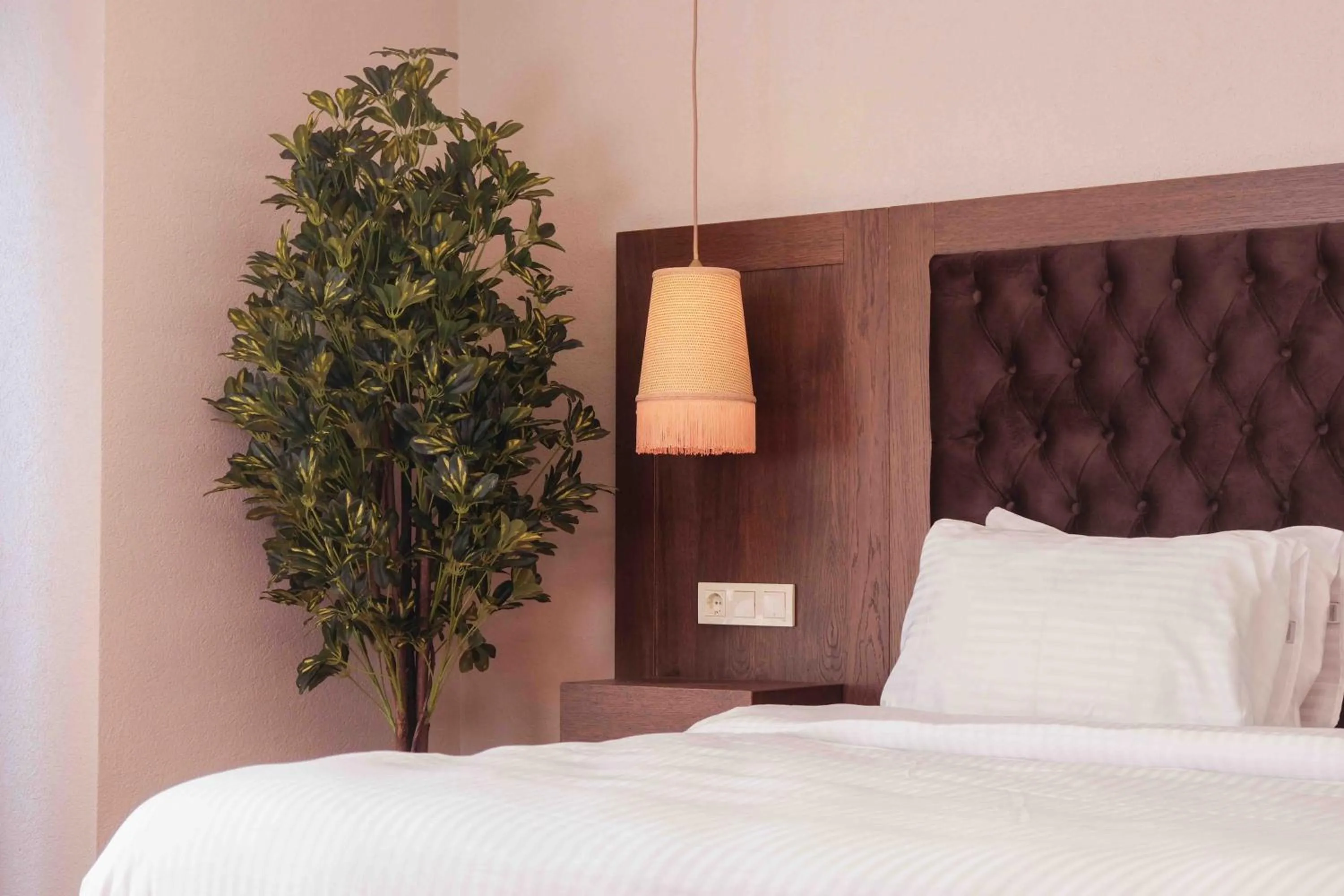 Bed in Phellos Suites Boutique Hotel