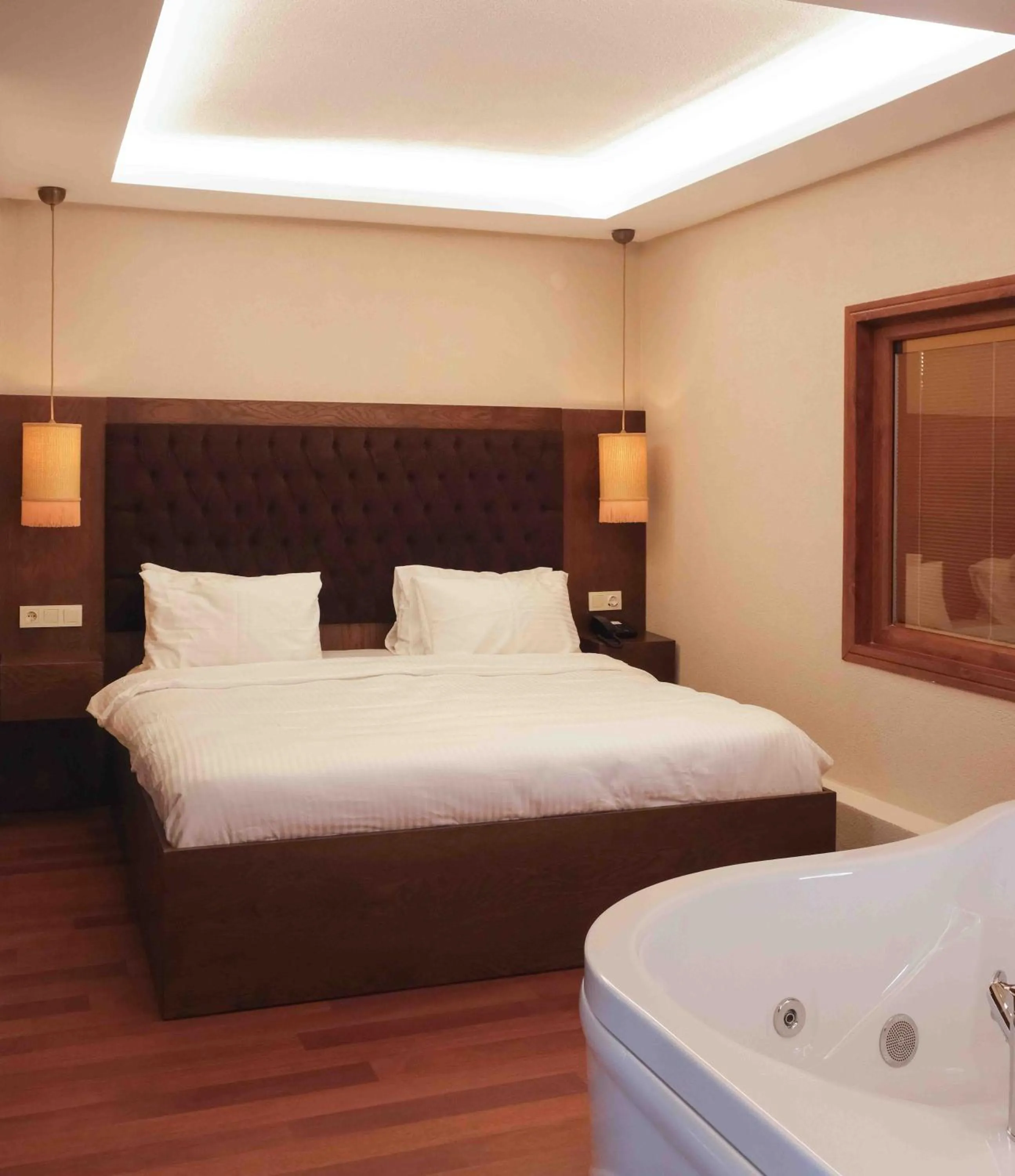 Bed in Phellos Suites Boutique Hotel