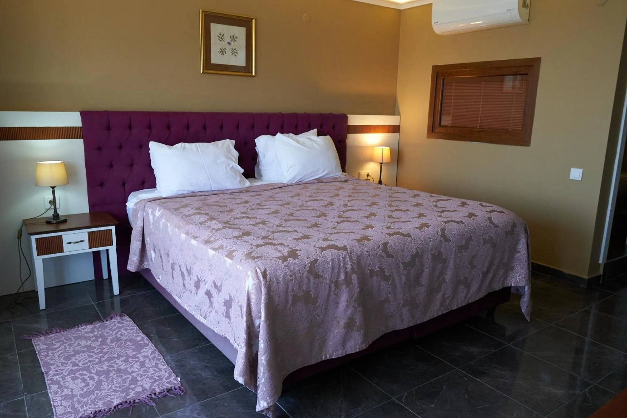 Bed in Phellos Suites Boutique Hotel