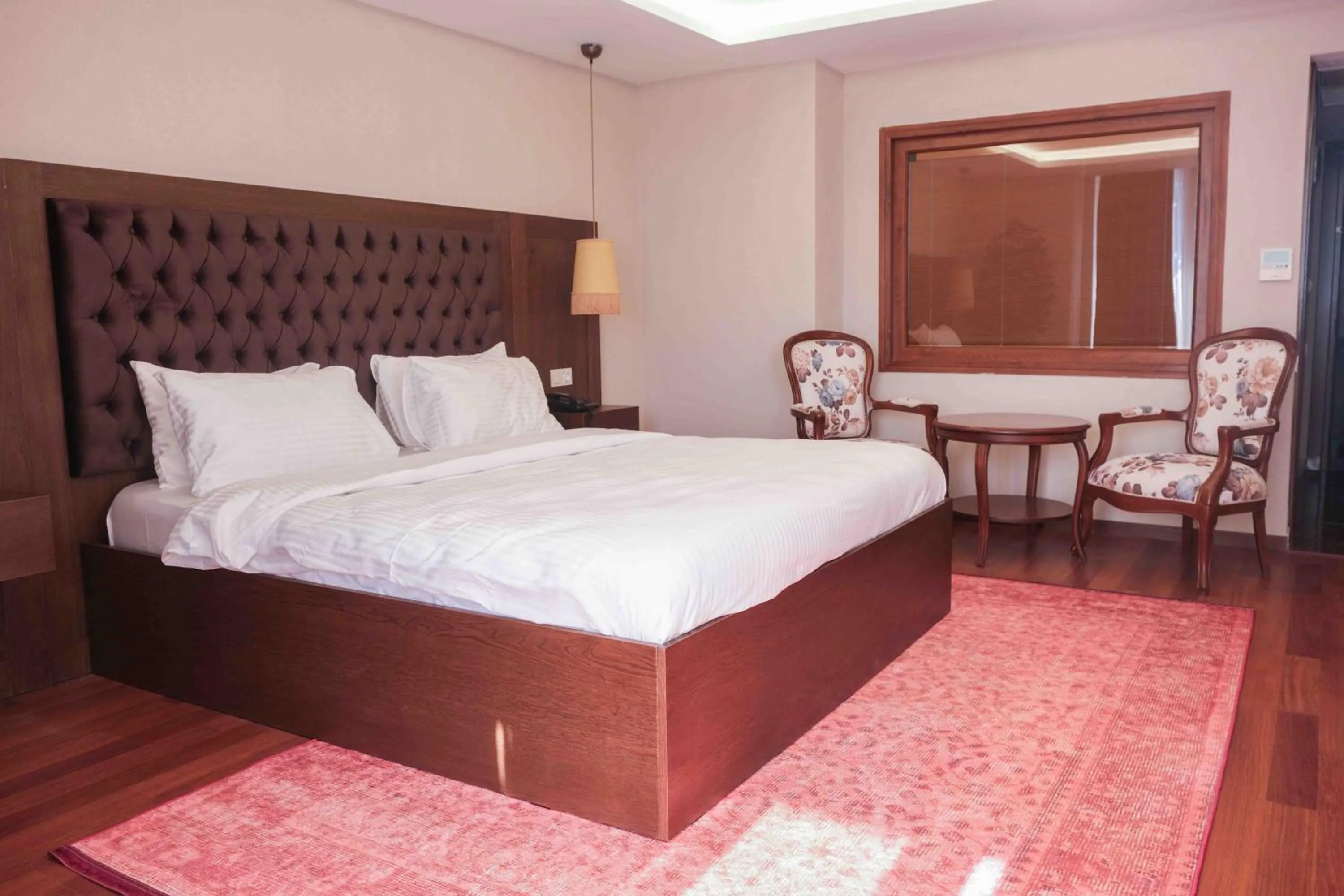 Bed in Phellos Suites Boutique Hotel