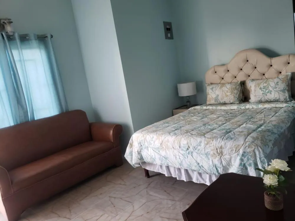 Bed in Dela de-Rose Guest House Negril Jamaica