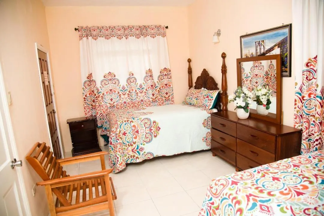 Bed in Dela de-Rose Guest House Negril Jamaica