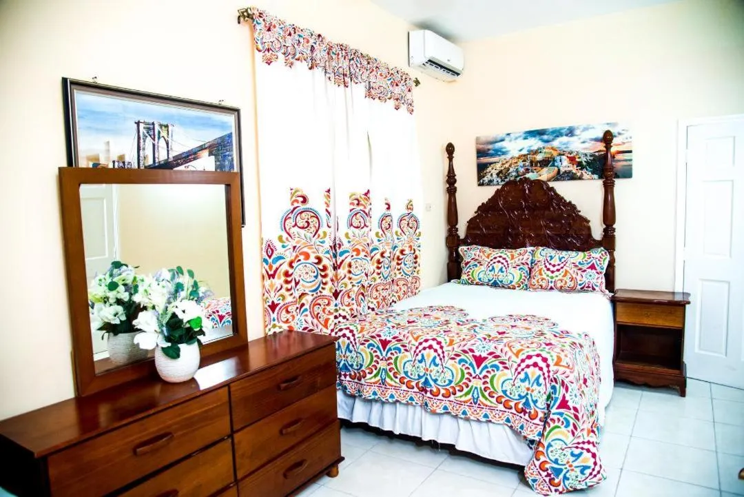 Bed in Dela de-Rose Guest House Negril Jamaica