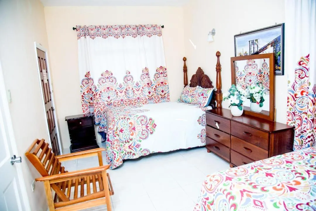 Bed in Dela de-Rose Guest House Negril Jamaica