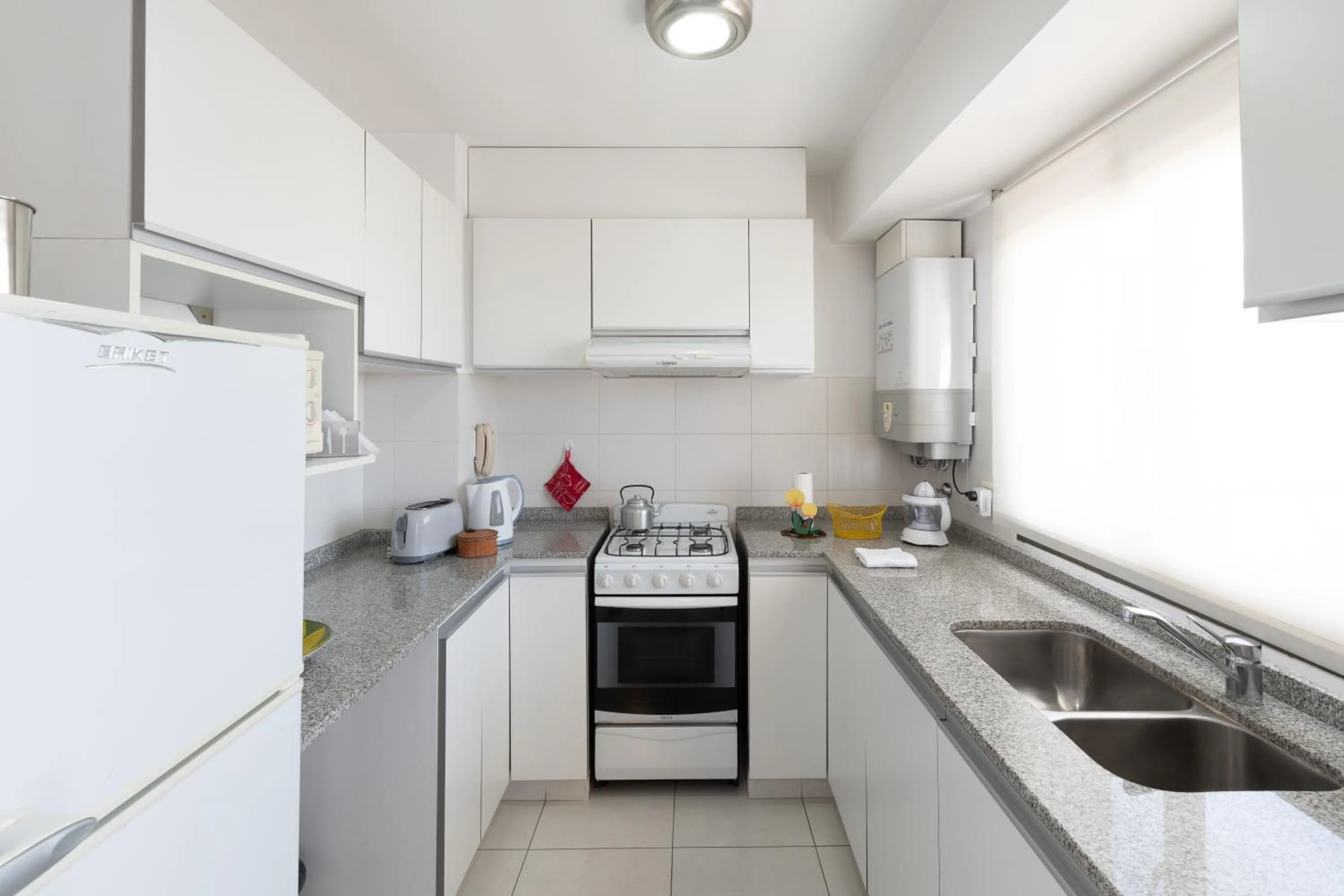 Kitchen or kitchenette in AT Suites