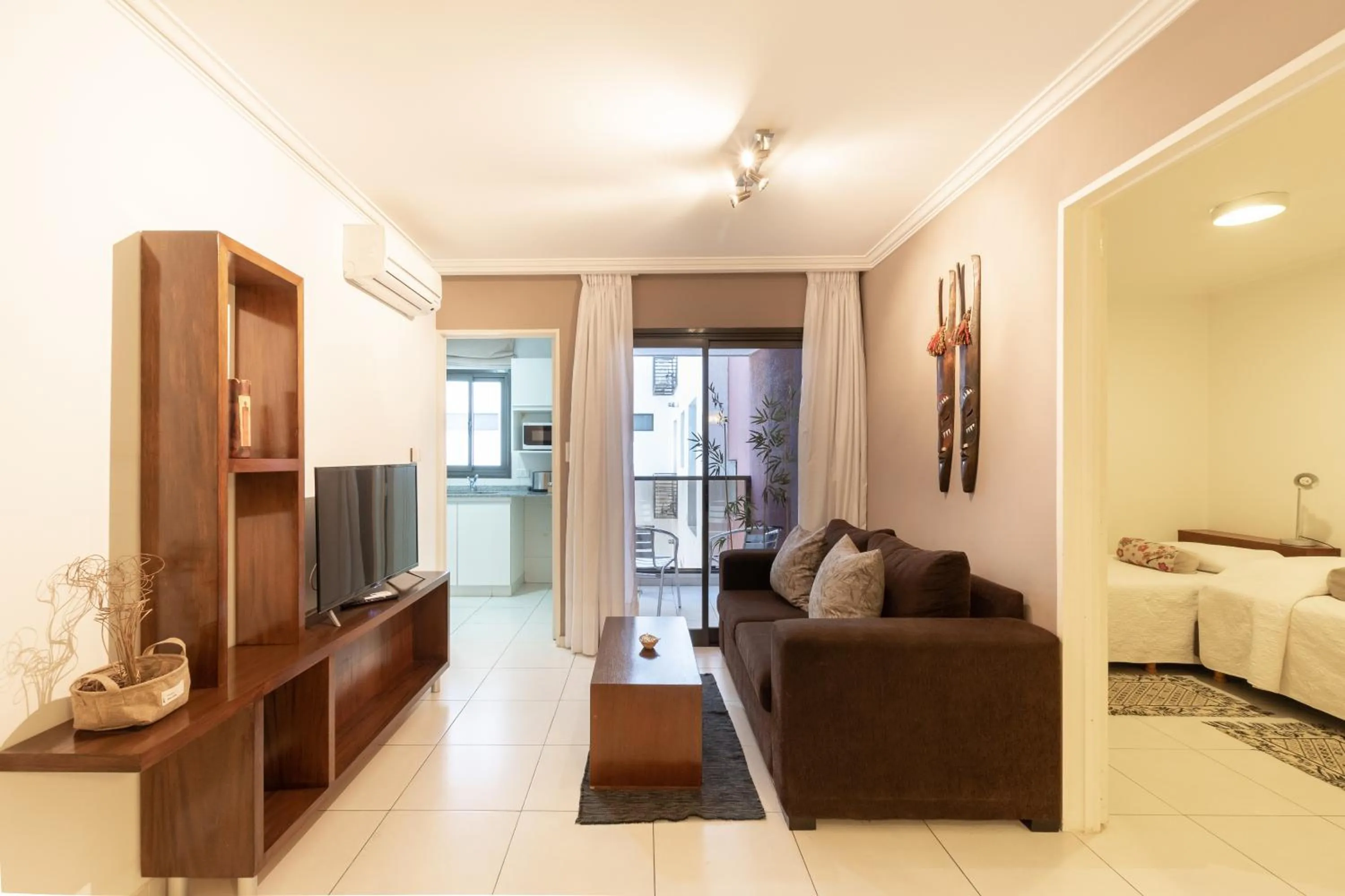 Living room, Bed in AT Suites