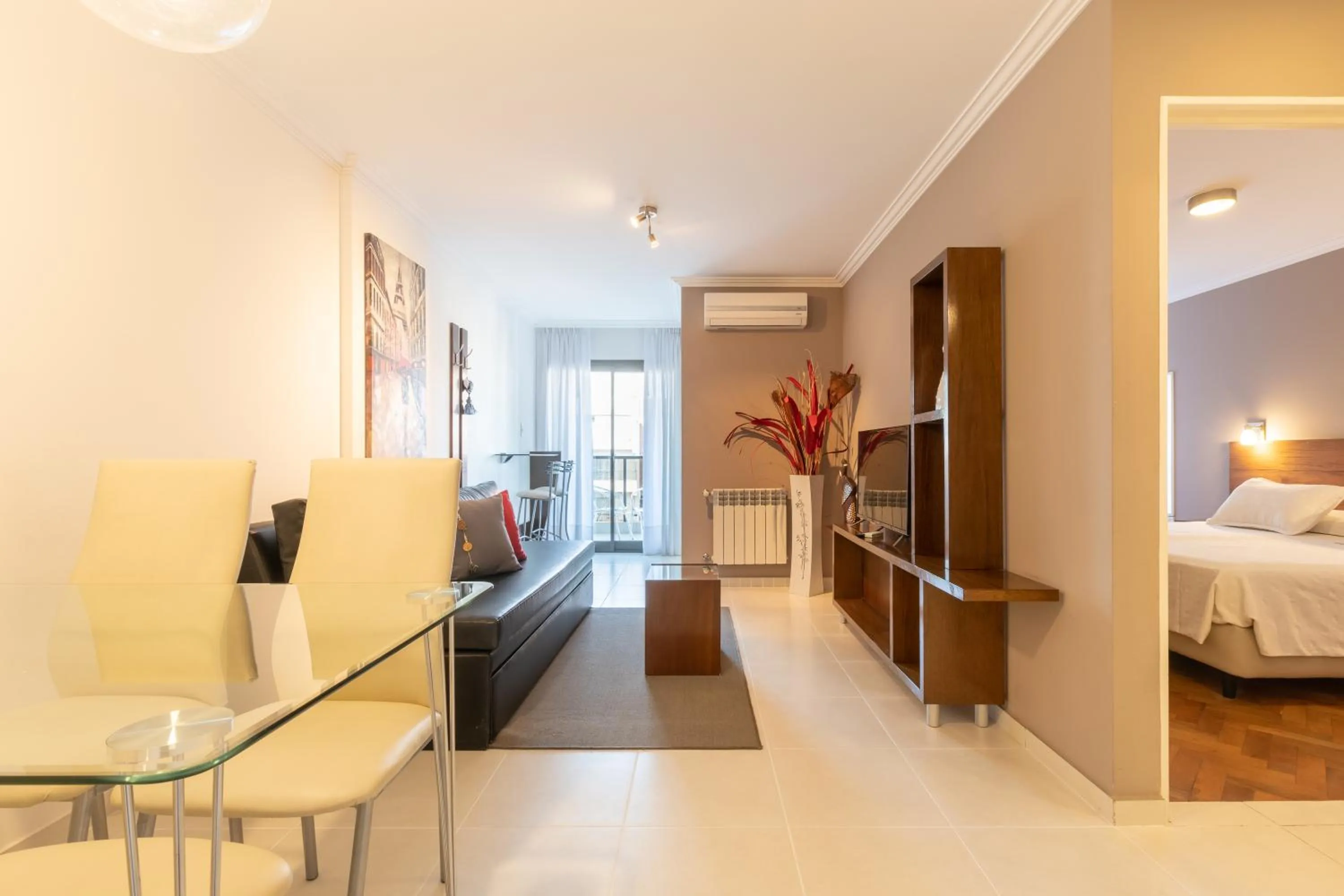 Living room, Bed in AT Suites