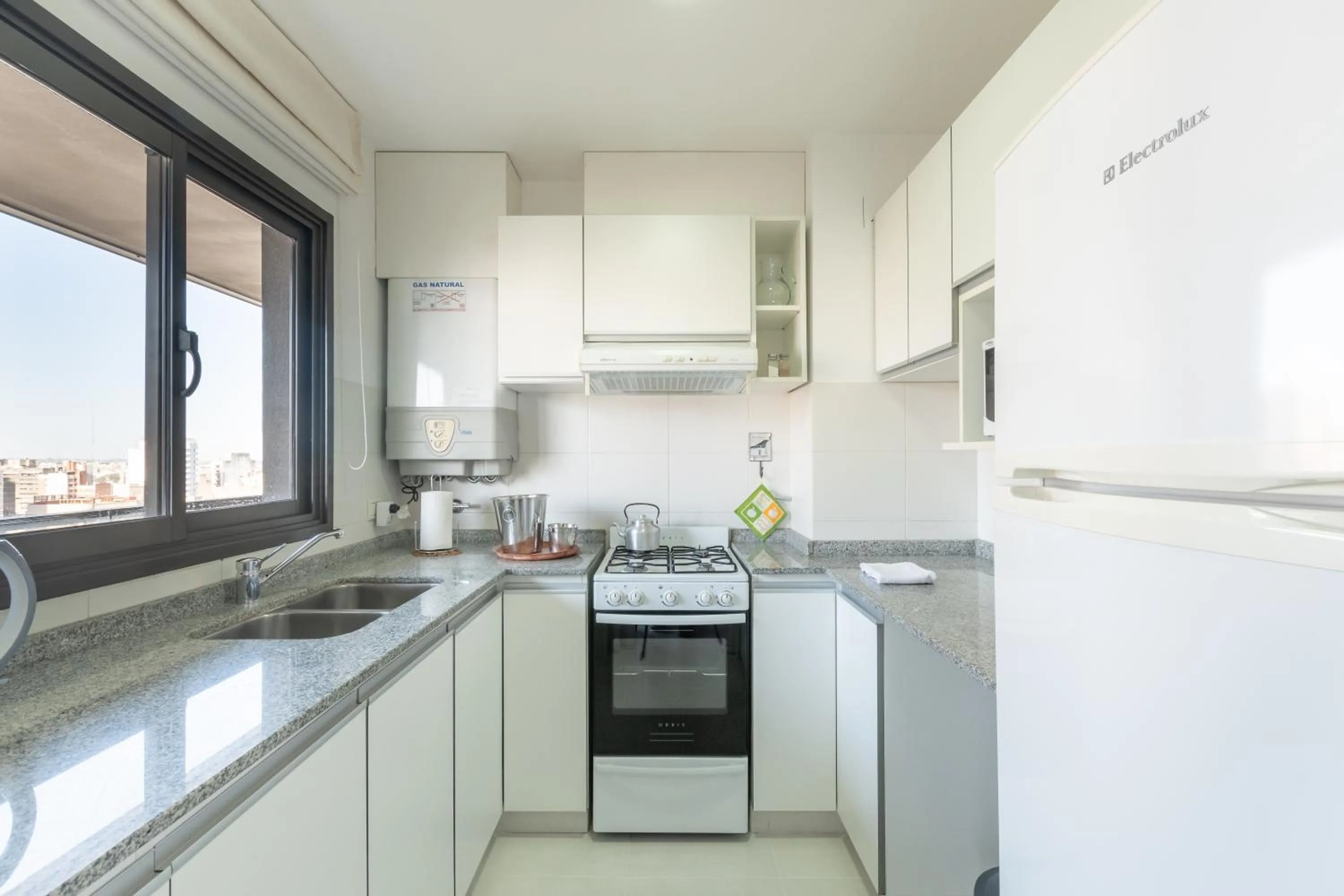 Kitchen or kitchenette in AT Suites