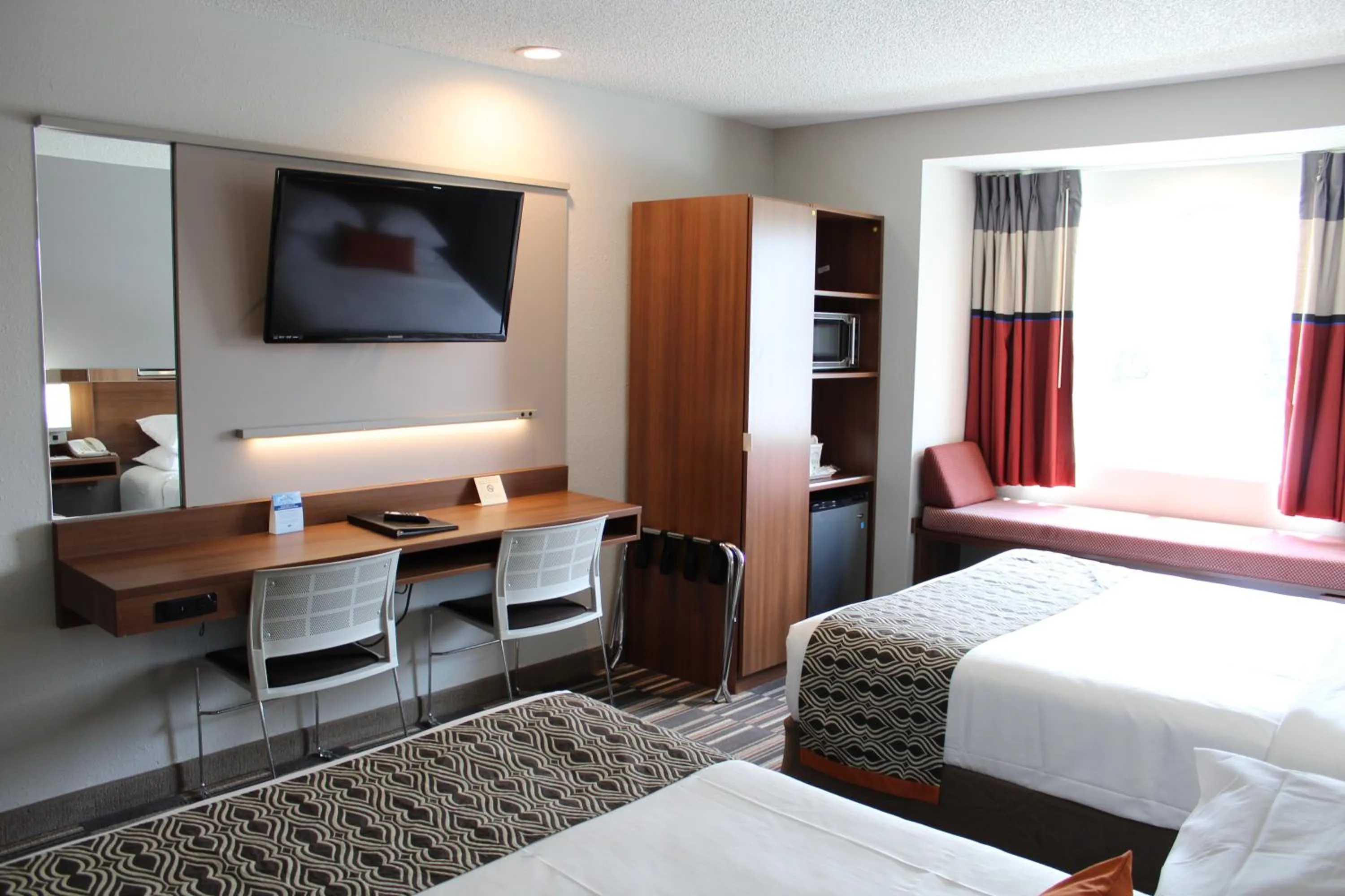 Bed in Microtel Inn & Suites by Wyndham