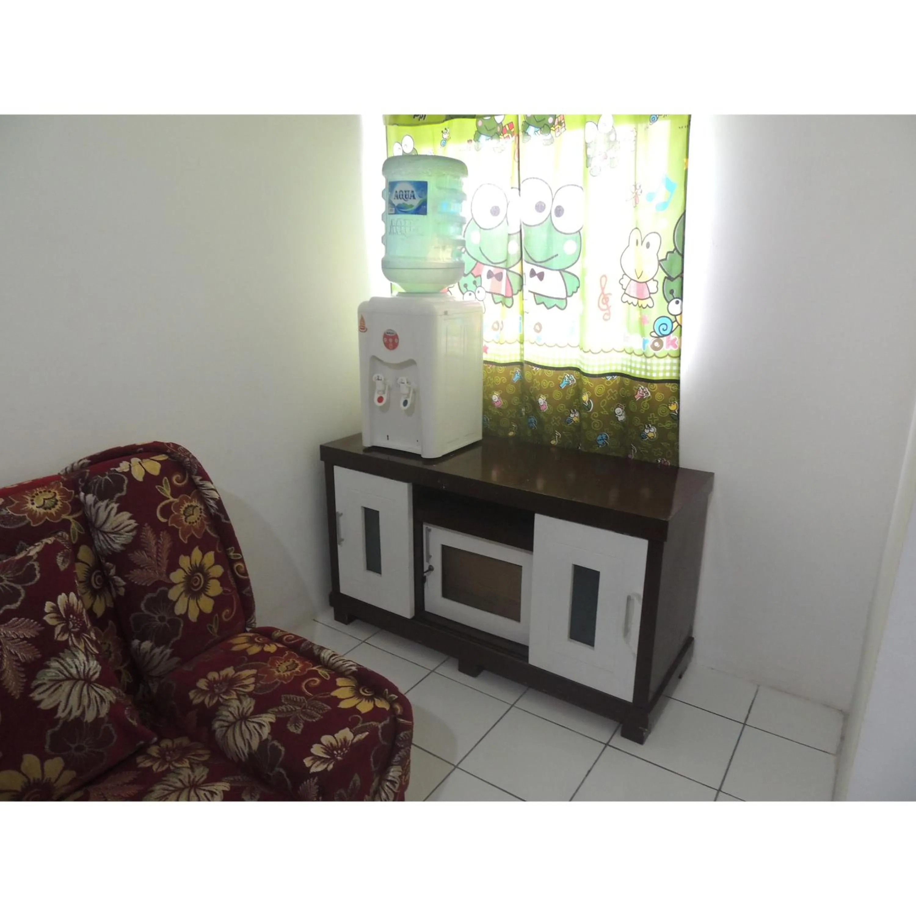 Seating area in Reva Room on Gunung Putri Square Apartment