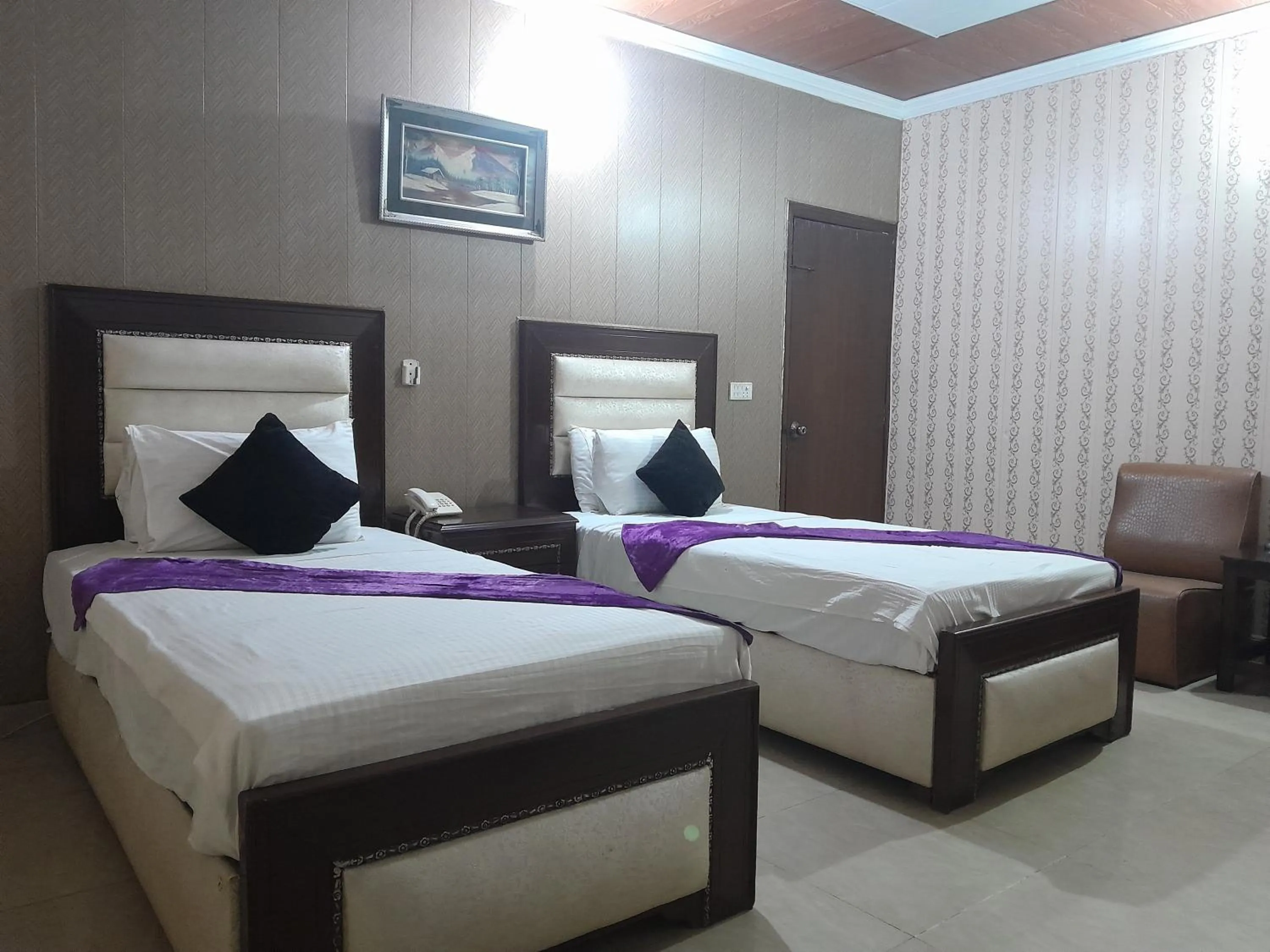 Bed in Hotel Tulip INN Faisal Town