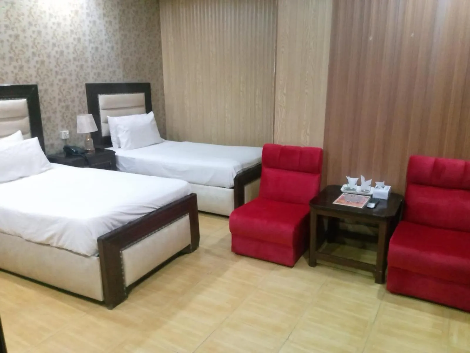 Seating area, Bed in Hotel Tulip INN Faisal Town