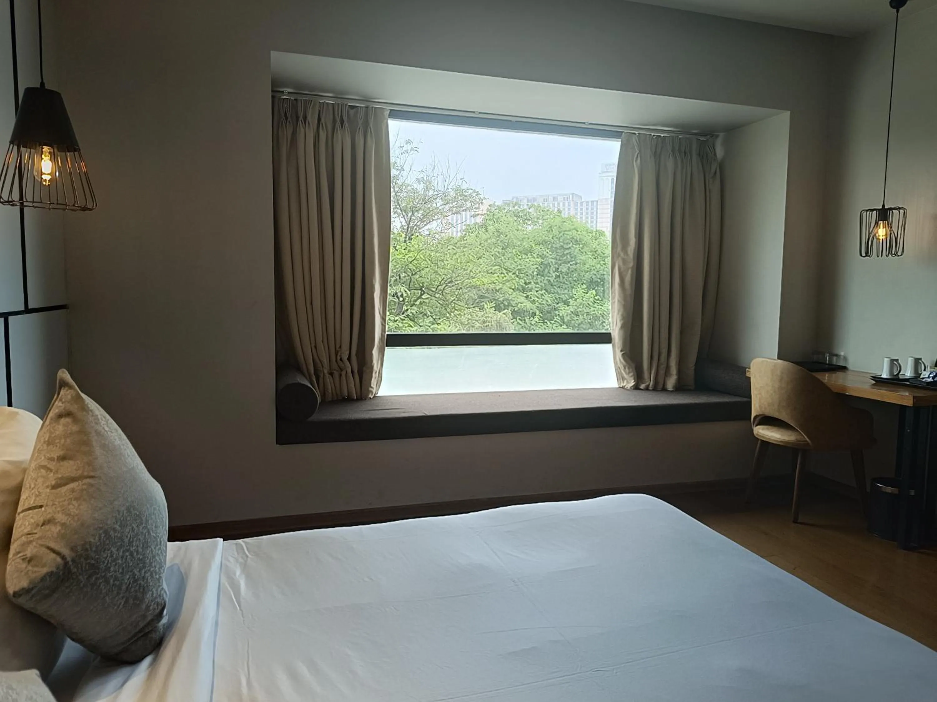 View (from property/room), Bed in Udman Hotel Greater Noida
