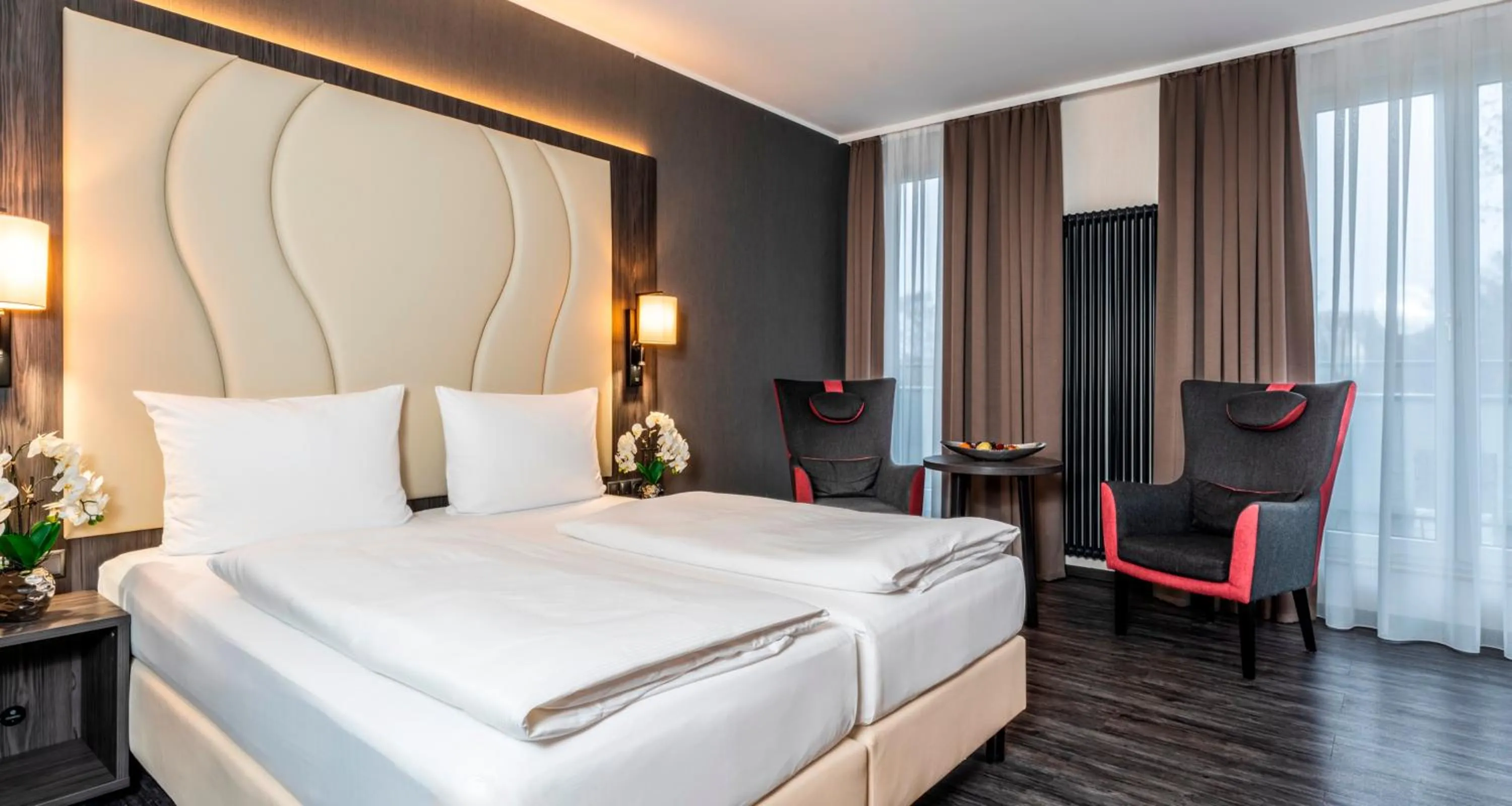 Bed in PLAZA Premium Parkhotel Norderstedt