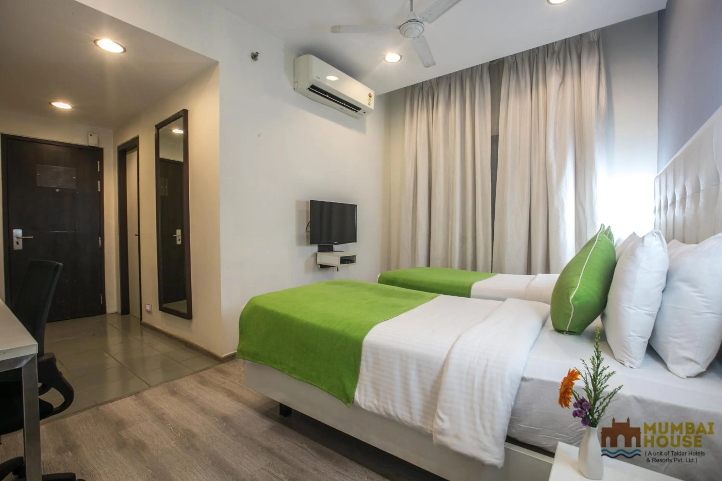 Photo of the whole room, Bed in Hotel Mumbai House Airoli, Navi Mumbai