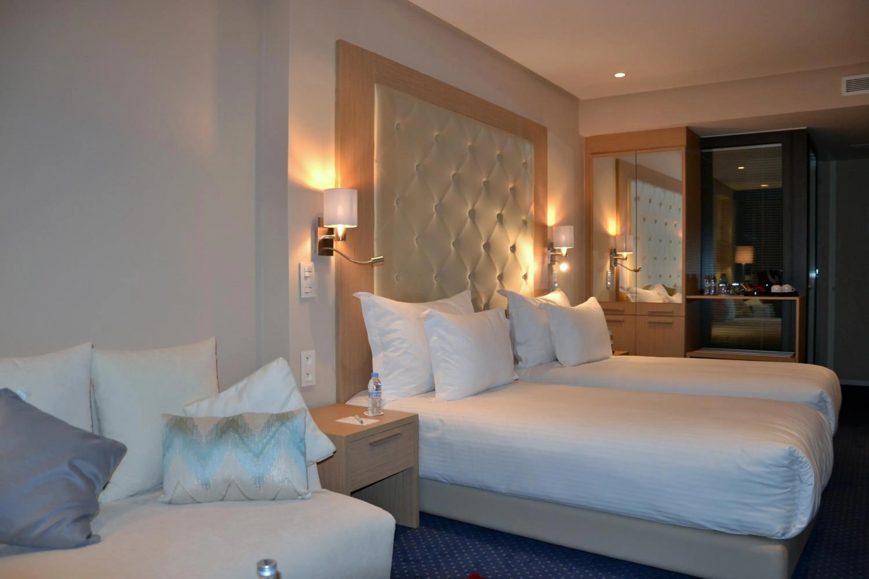 Seating area, Bed in Flower Town Hotel & Spa