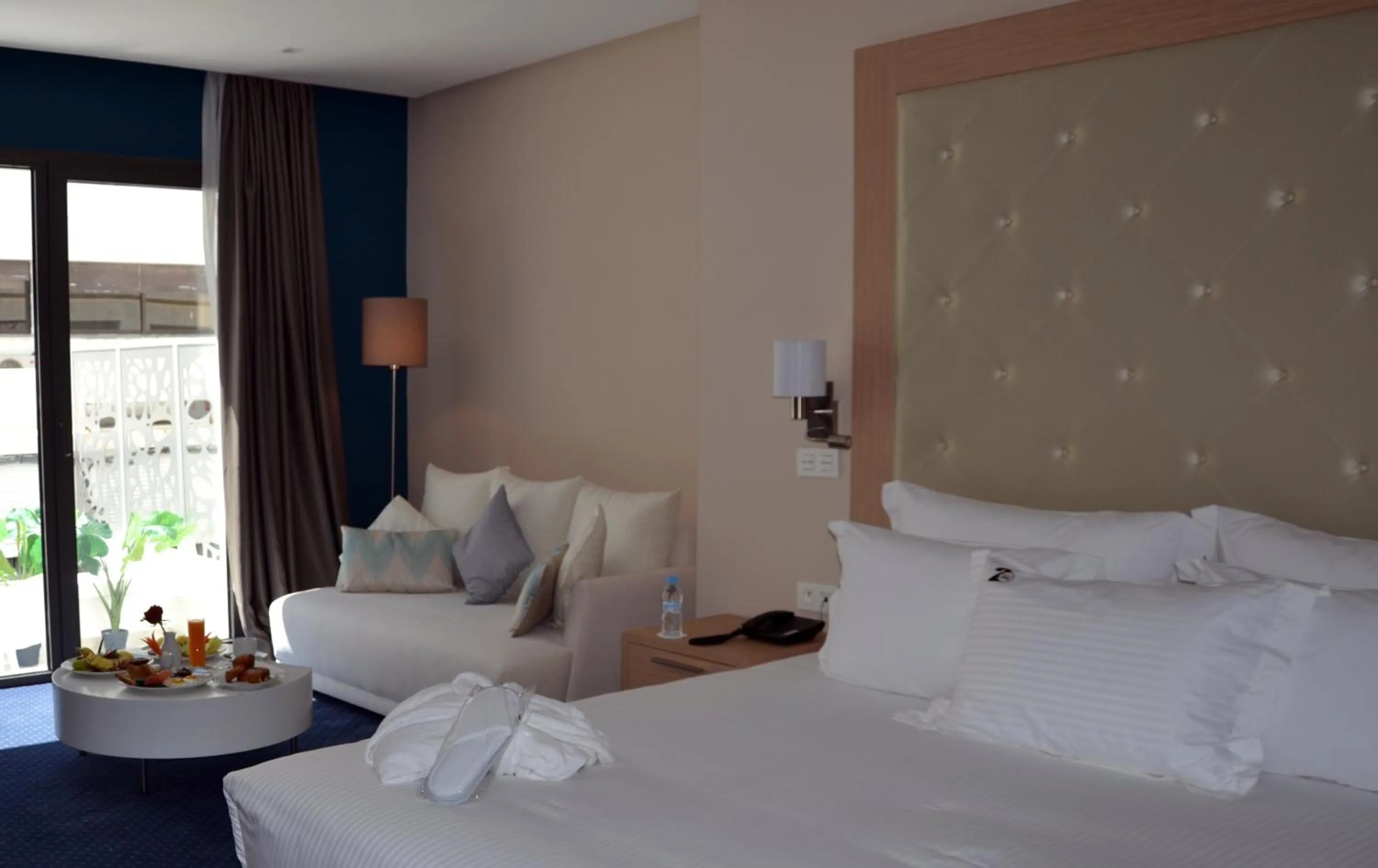 Living room, Bed in Flower Town Hotel & Spa