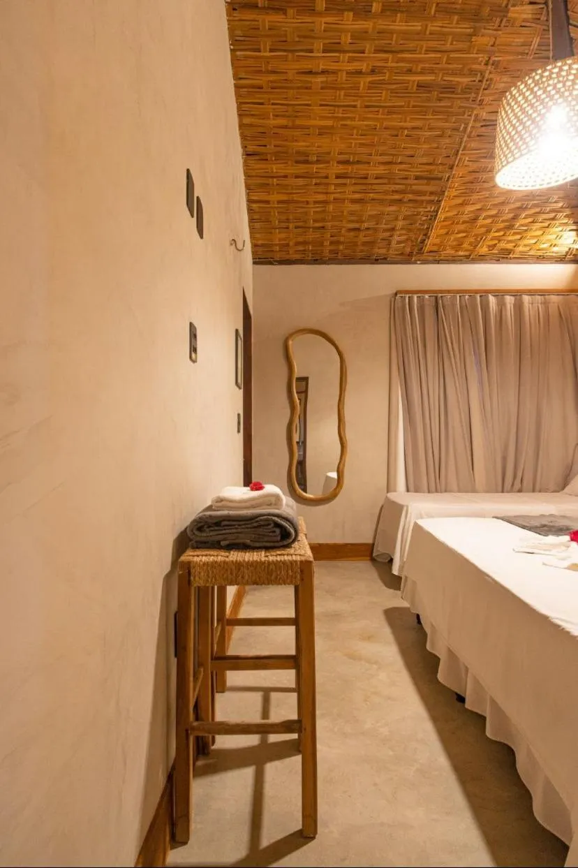 Bed in Pousada Rota dos Ventos