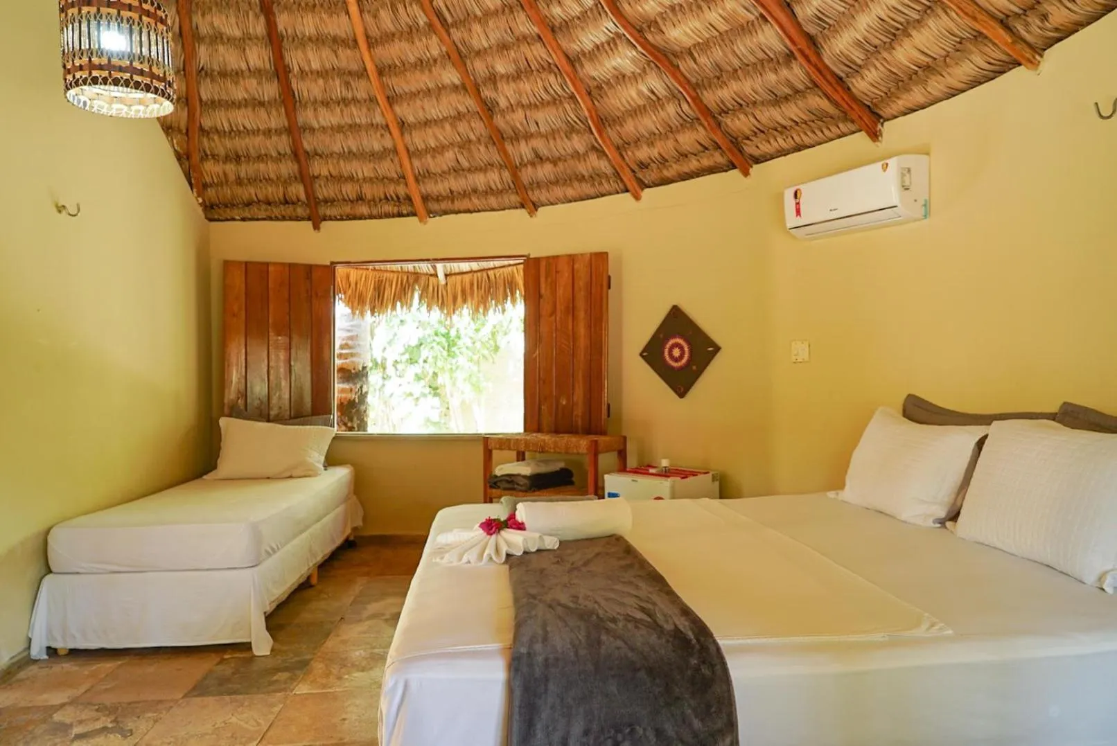 Bed in Pousada Rota dos Ventos